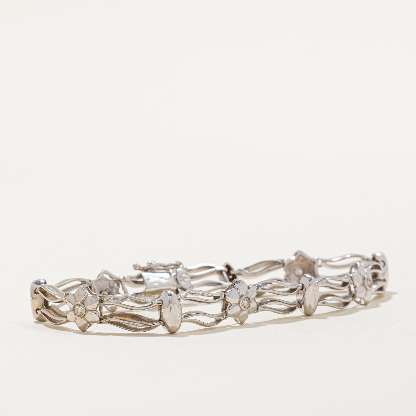 0.10ctw Diamond Flower Bracelet for Women - 7 Inch Adjustable Sterling Silver Charm Bangle | Perfect for Weddings, Anniversaries & Special Occasions