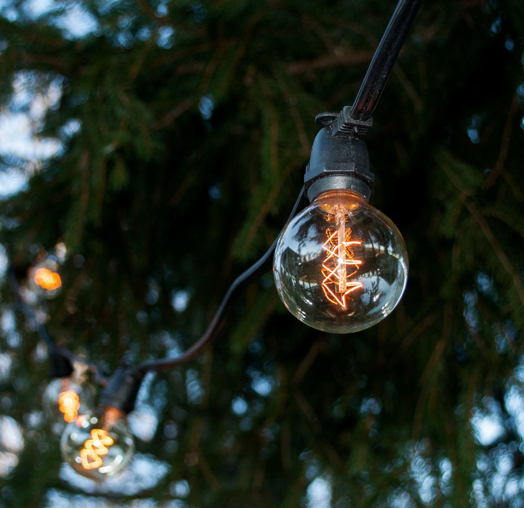 Commercial Edison Bulb Outdoor String Lights - 100 ft G50 Spiral Filament with Hand-Threaded Design & Black Weatherproof Wire | Perfect for Patio, Garden, Wedding, Cafe & Restaurant Decoration