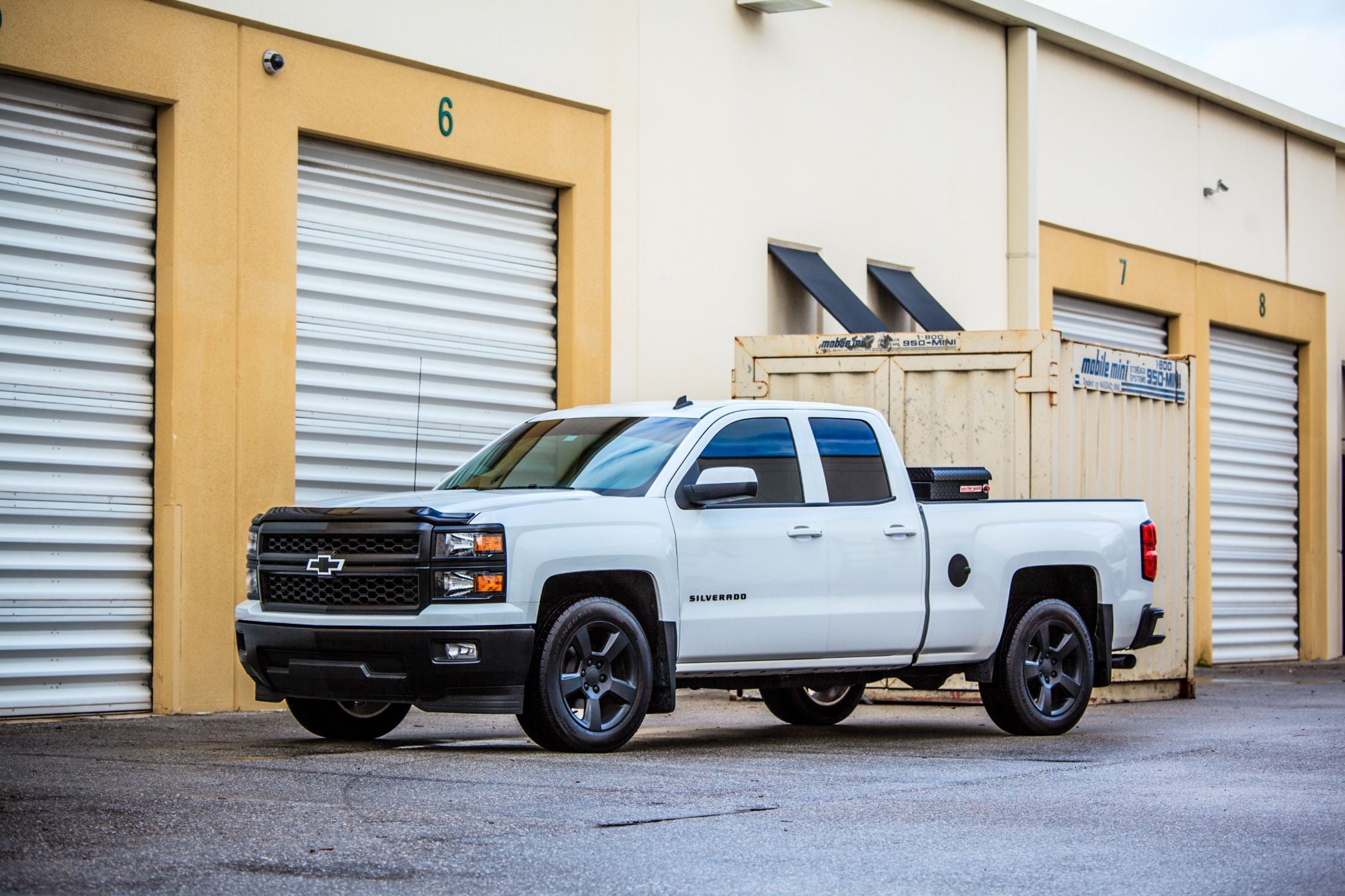 JL Audio SB GM SLVD/10TW1/BK Stealthbox Subwoofer Enclosure for 2014+ Chevy Silverado & GMC Sierra Double Cab Trucks - 2x10W1 Subwoofers, 600W Power - Perfect for Jet Black/Dark Ash Interiors | Upgrade Your Truck Audio System for Powerful Bass on the Road