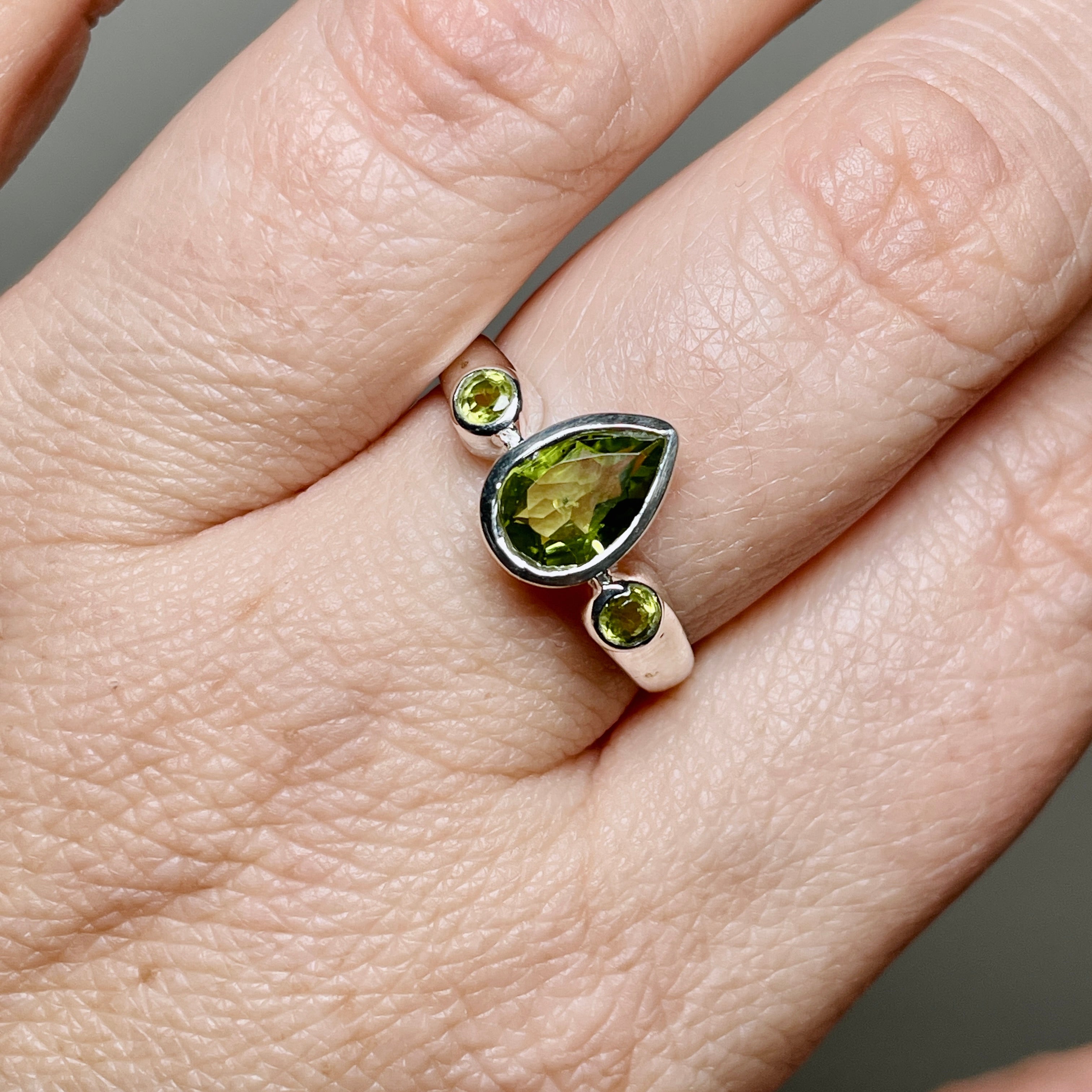 Peridot Faceted Gemstone Teardrop Ring with Accent Stones R3668 - Elegant Green Jewelry for Women, Perfect for Weddings, Parties & Special Occasions