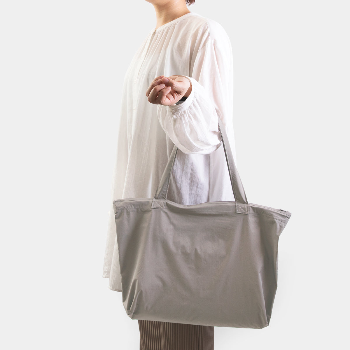 TRAVELER'S COMPANY Traveler's Factory x TO&FRO Waterproof Rain Bag in Warm Gray - Perfect for Outdoor Adventures, Commuting & Travel