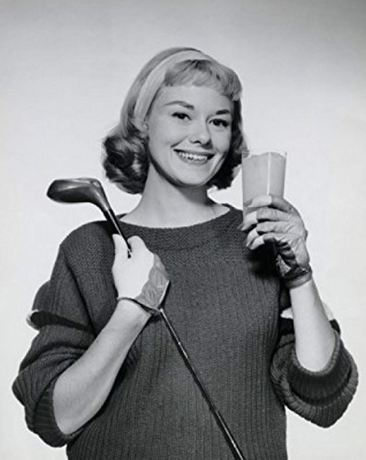 Portrait of a Young Woman Holding Juice & Golf Club - 18x24 Poster Print - Vintage Golf Art Decor for Home, Office or Sports Bar