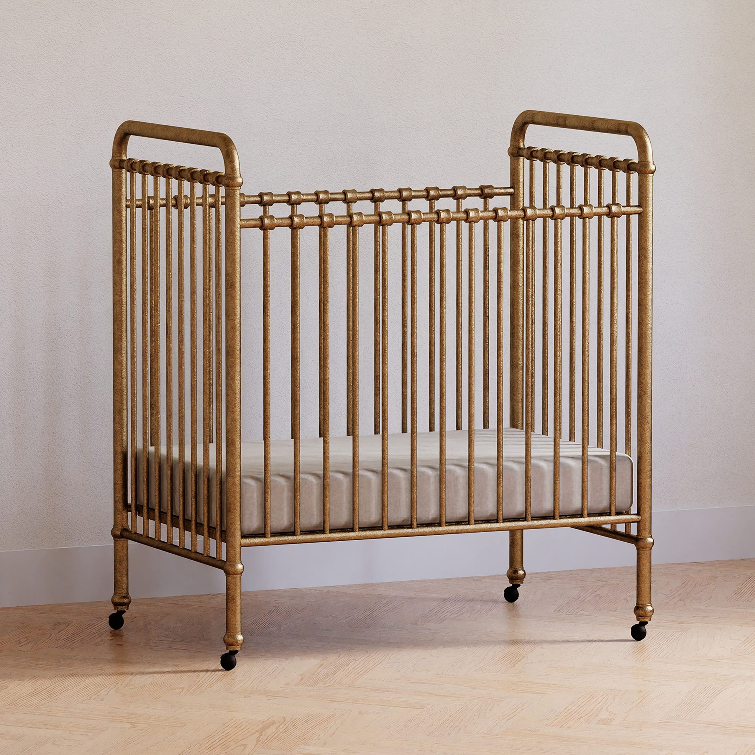 NAMESAKE Abigail 3-in-1 Convertible Mini Metal Crib in Vintage Gold - Greenguard Gold Certified Safe Nursery Furniture for Small Spaces | Perfect for Apartments, Nursery Rooms & Guest Bedrooms