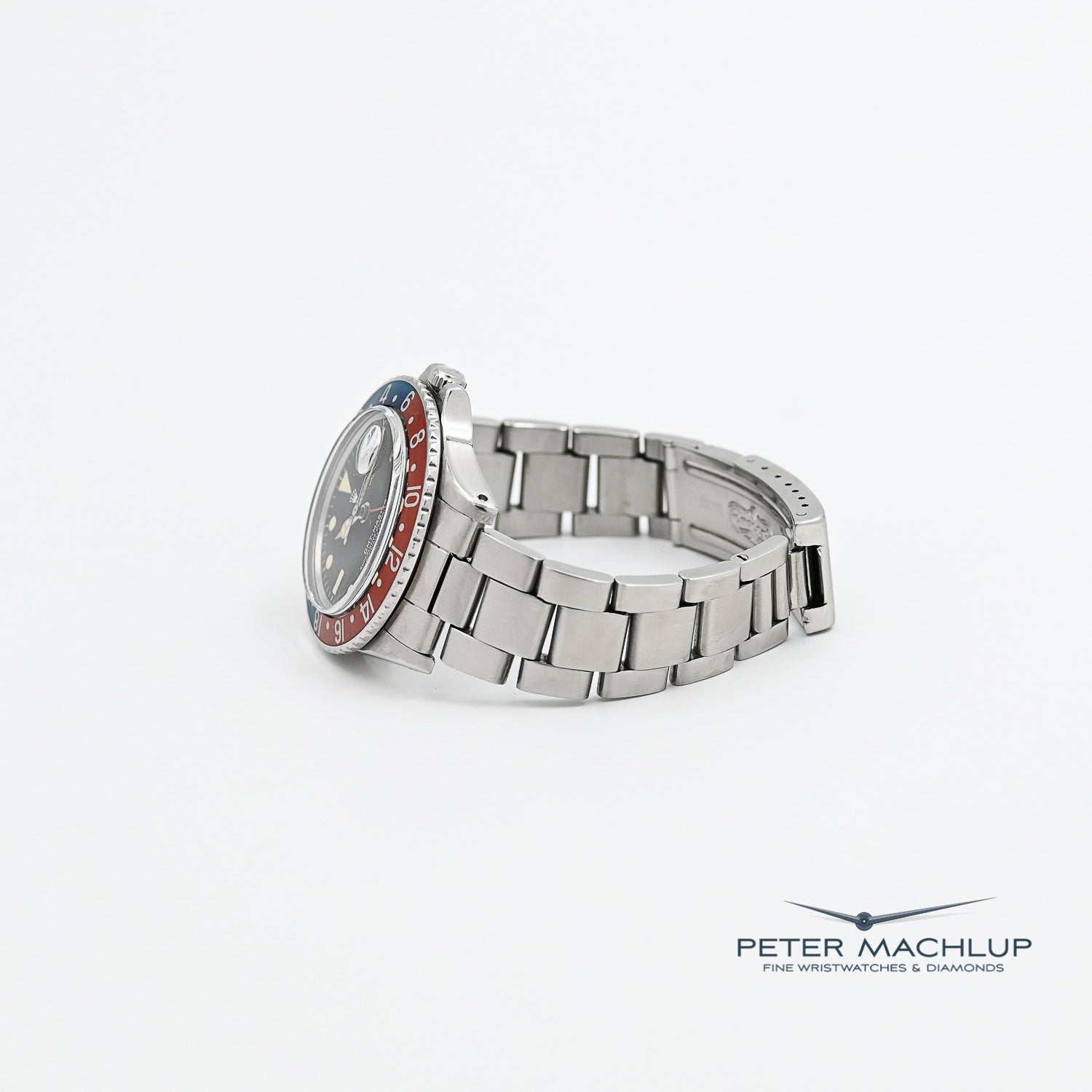 Vintage Rolex GMT-Master Pepsi 1675 Men's Watch - 1975 Model, Stainless Steel, Red & Blue Bezel - Perfect for Collectors & Travel Enthusiasts