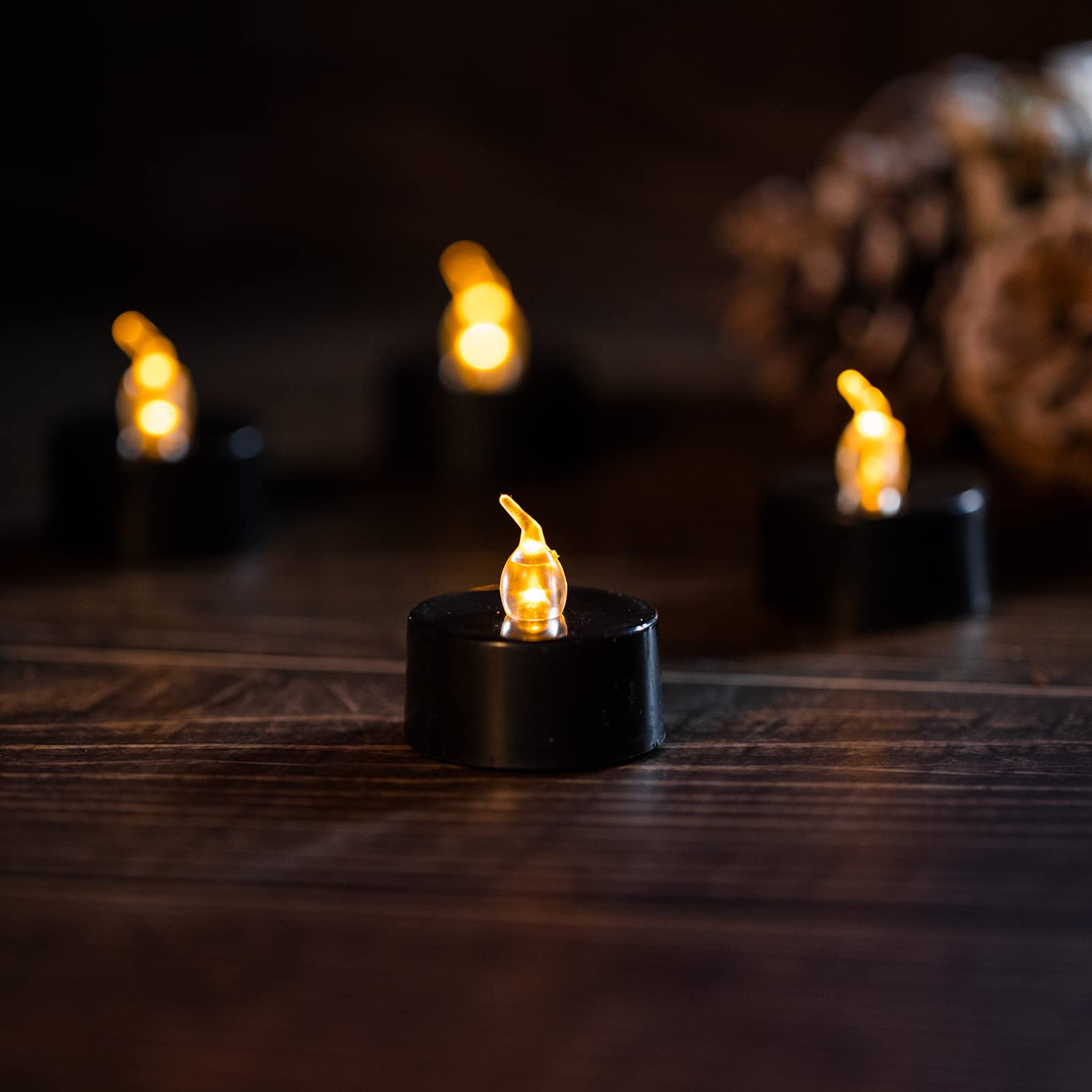 LANKER 24 Pack Black Tea Light Candles - Flameless LED Candles with Flickering Warm Yellow Flame, Battery Operated Fake Candles for Wedding, Halloween & Christmas Decor - Perfect for Centerpieces, Table Settings & Holiday Displays