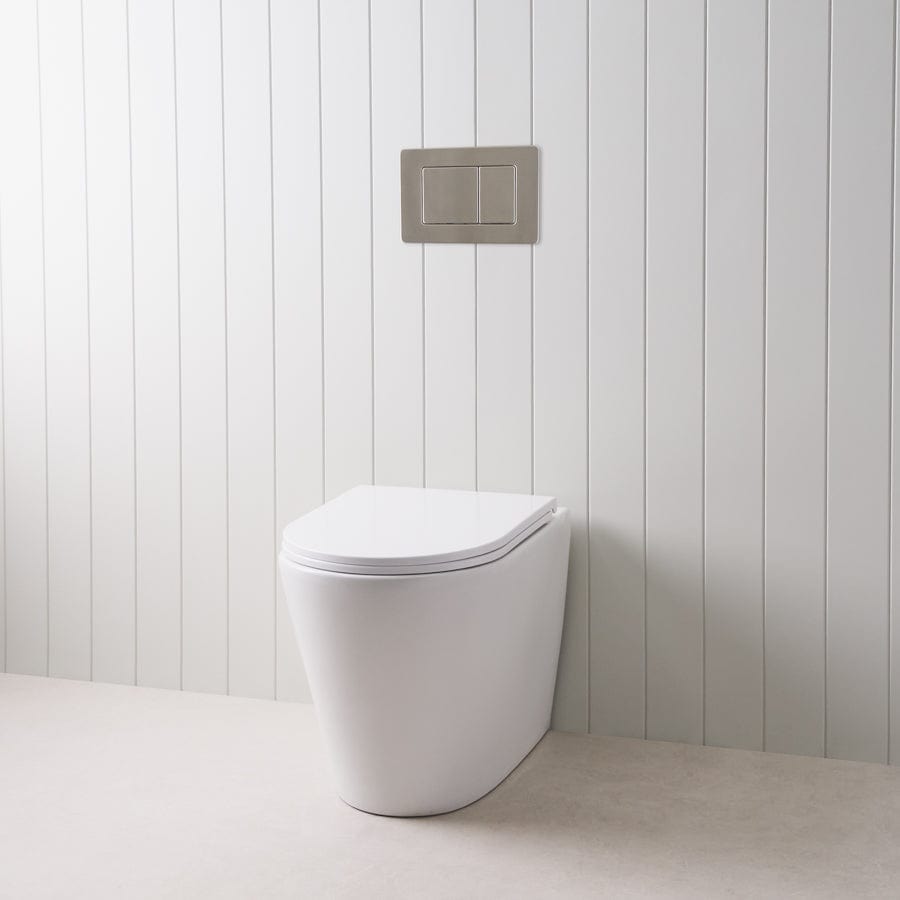 Stylish Curved In-Wall Toilet with Round Gunmetal Buttons - Modern Space-Saving Bathroom Solution for Small Homes and Luxury Apartments