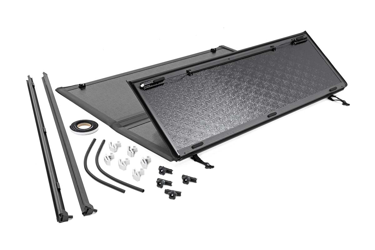 2005-2022 Nissan Frontier Hard Tri-Fold Tonneau Cover | 5ft Bed Truck Accessory | Durable Cargo Protection for Camping & Outdoor Adventures