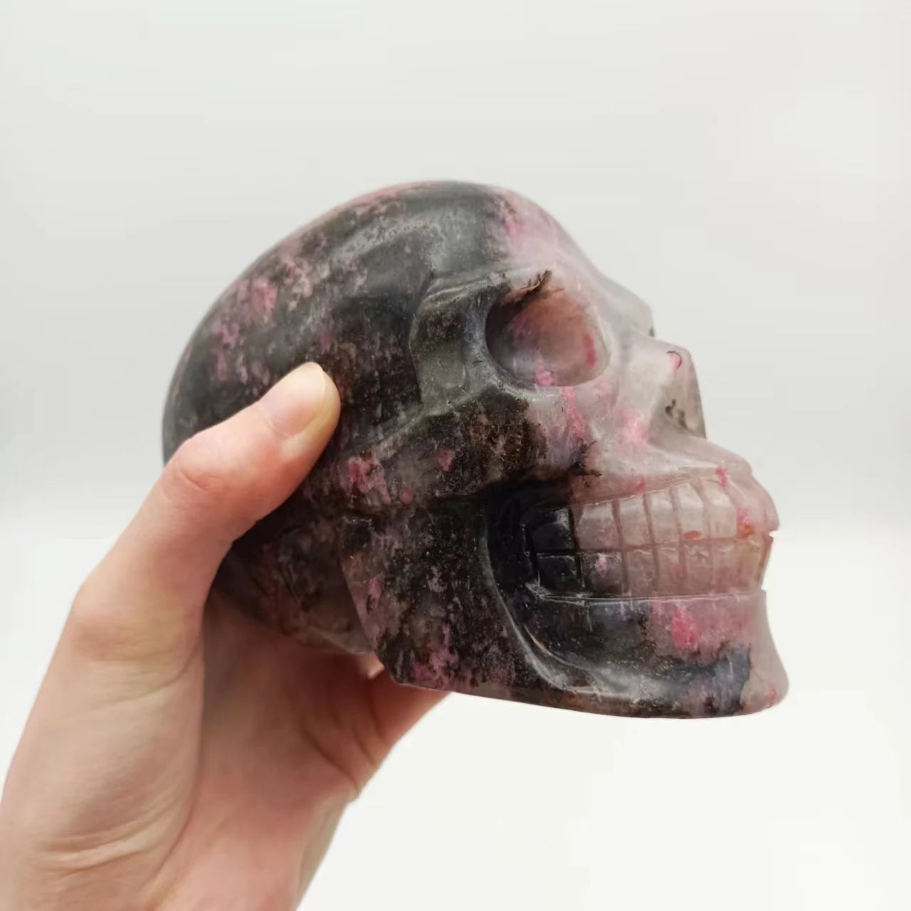 Natural Dark Rhodonite Skull Healing Crystal - Hand-Polished Gemstone Sculpture for Home Decor, Meditation, and Halloween Gifts | Spiritual Healing, Altar Decor, Unique Present