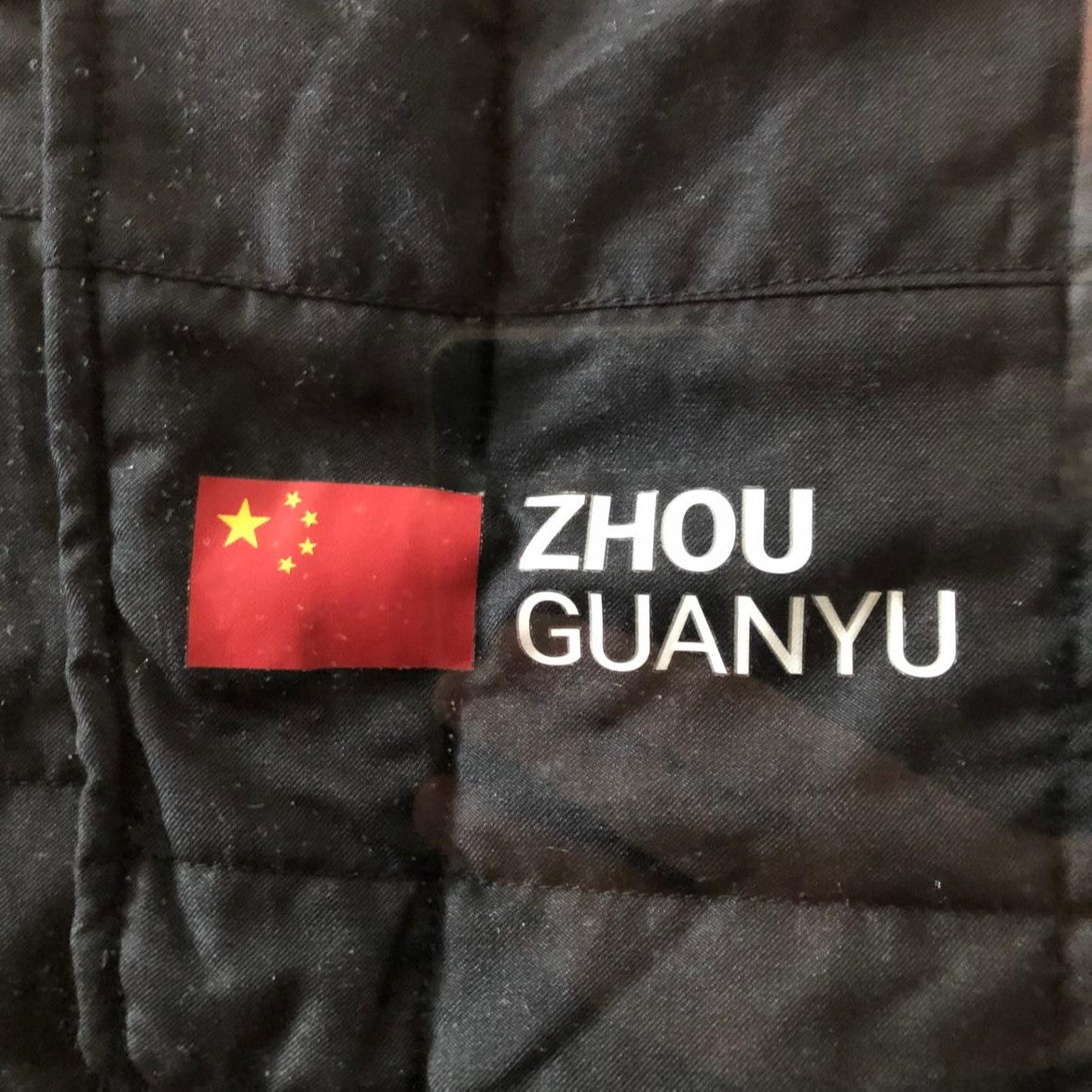 Authentic Signed Race-Worn Zhou Guanyu F1 Suit - Gulf Air Bahrain Grand Prix 2023 | Collectible Motorsport Memorabilia for Display & Investment