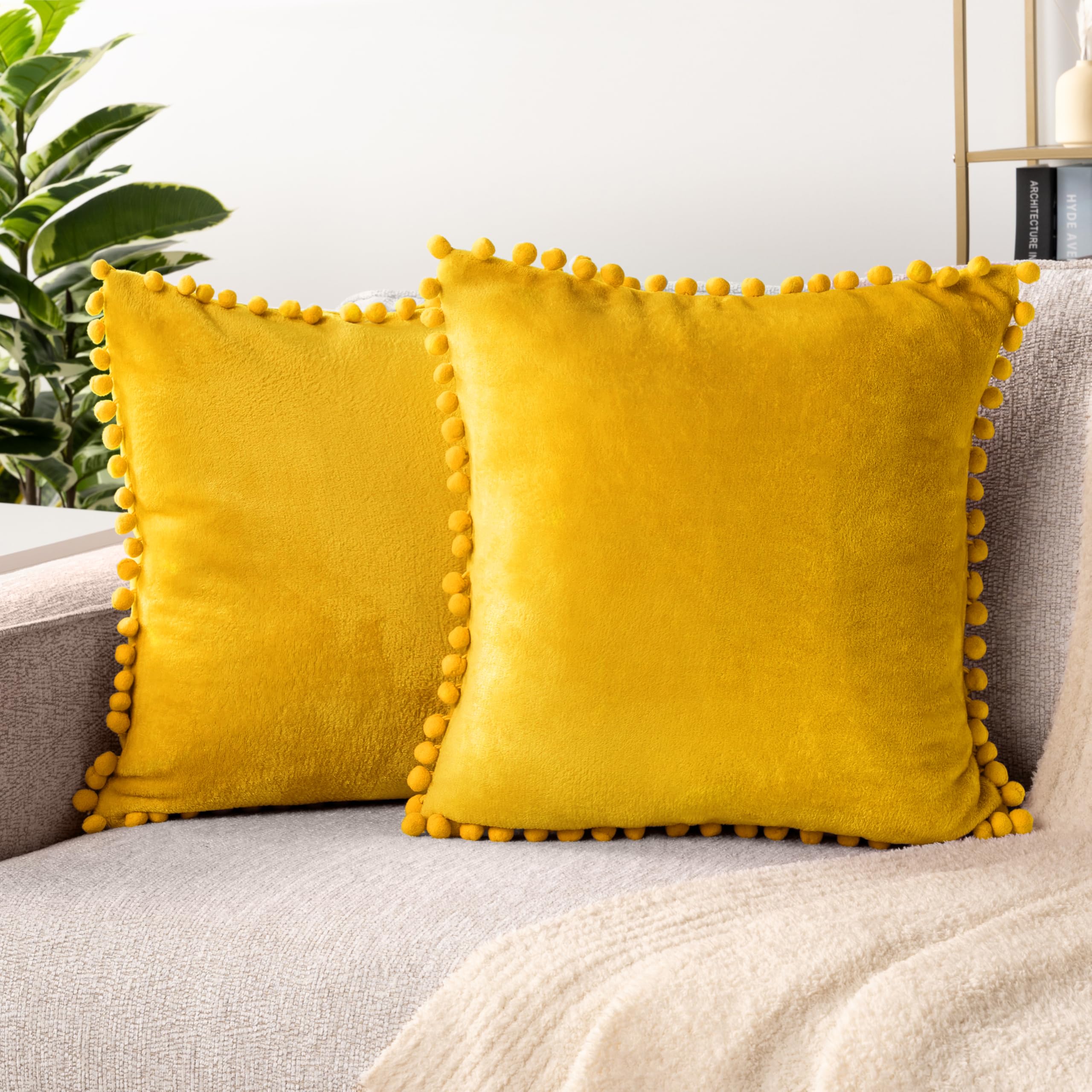 PAVILIA Mustard Yellow Velvet Euro Plush Throw Pillow Covers with Pom Pom - Set of 2 (20x20 Inches) - Decorative Cushion Covers for Bed, Sofa & Couch - Soft Luxury Pillowcases for Bedroom Aesthetic & Living Room Decor
