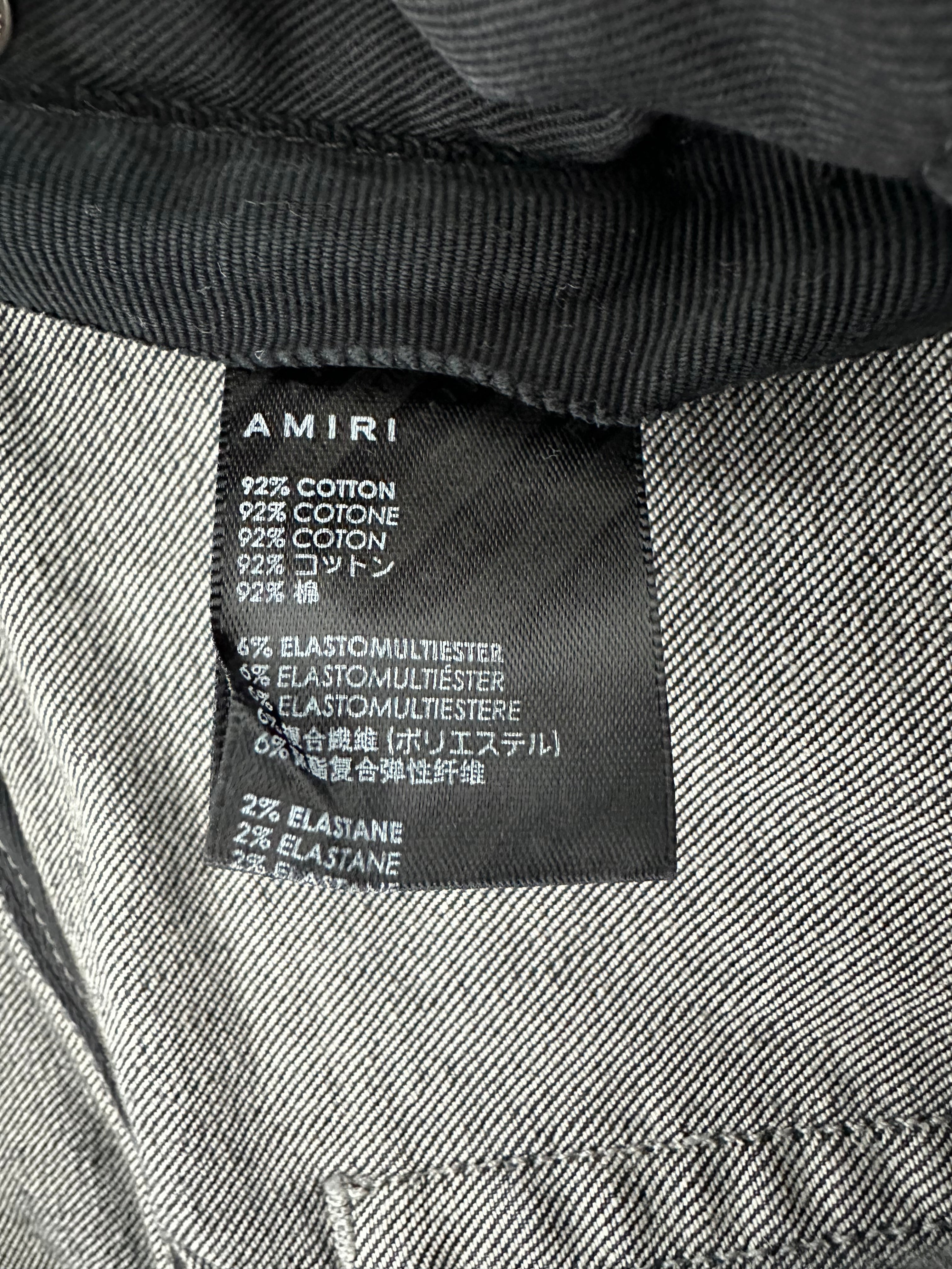 Amiri Grey & Black Bandana Patch Thrasher Jeans for Men - Distressed Denim Pants with Vintage Style - Perfect for Streetwear, Concerts & Casual Outfits