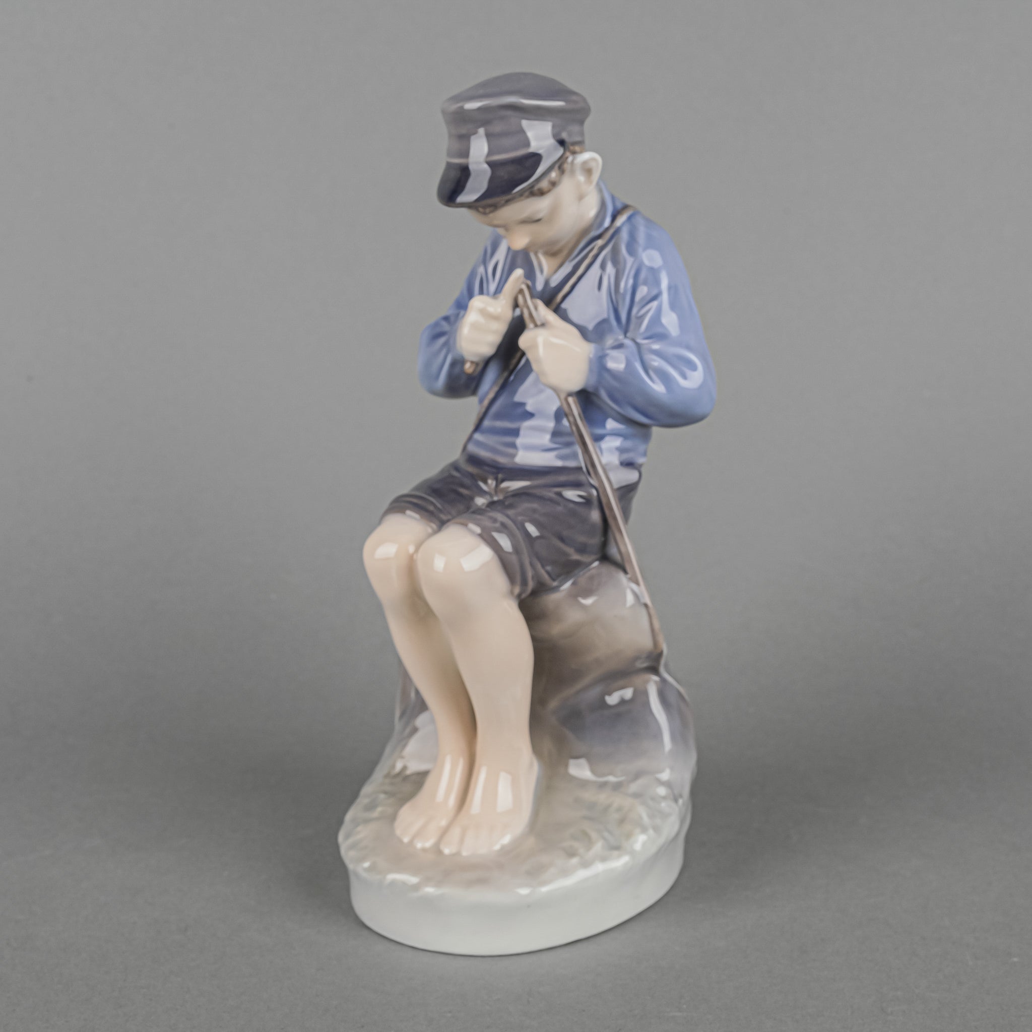 Royal Copenhagen Whittling Boy Porcelain Figurine - Handcrafted Danish Collectible for Home Decor & Gift Giving