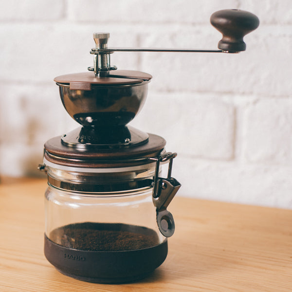 Hario Canister Coffee Grinder - Manual Ceramic Burr Mill for Fresh Ground Coffee - Perfect for Home, Office, and Travel Use