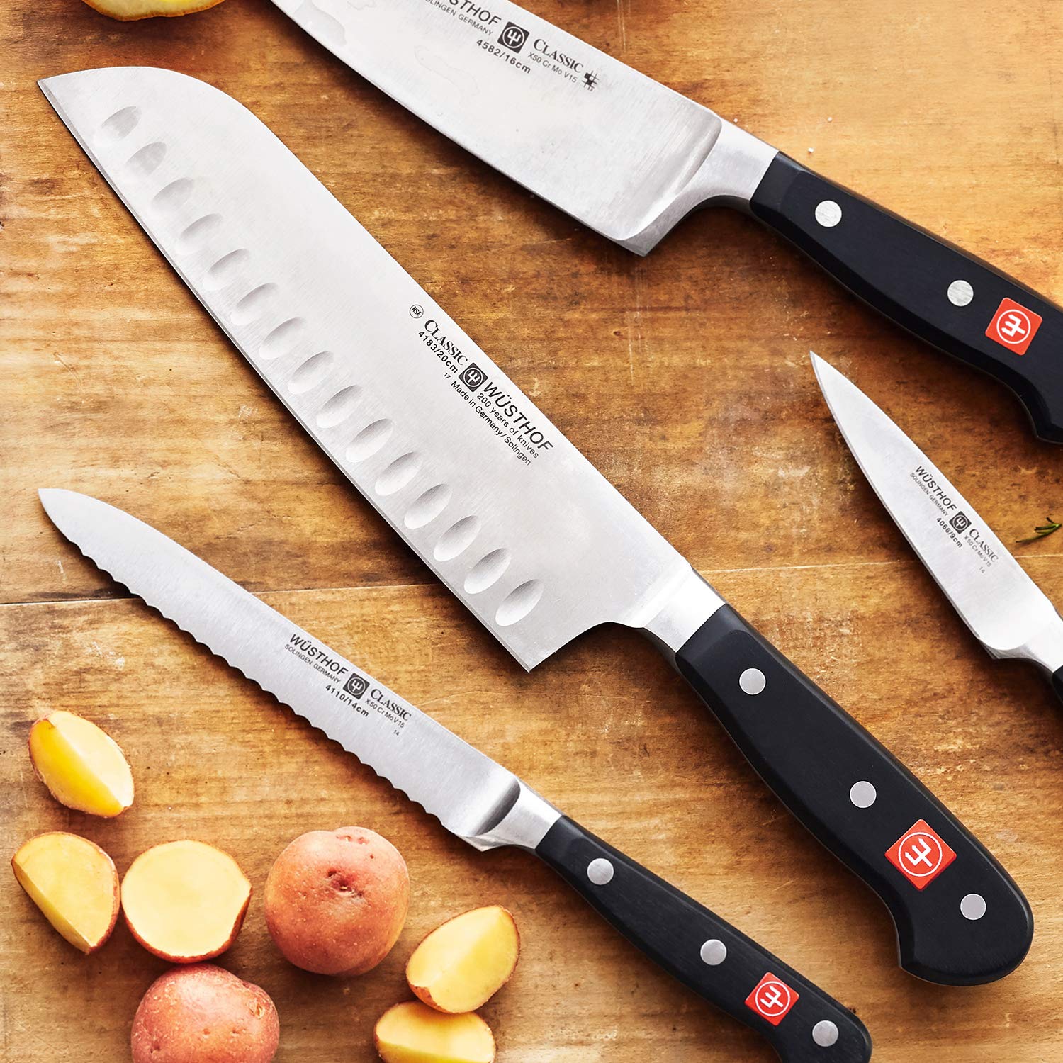 Wusthof Classic 7-Inch Santoku Knife - High Carbon Stainless Steel Blade with Ergonomic Black Handle - Perfect for Slicing, Dicing & Mincing Vegetables, Meat & Fish