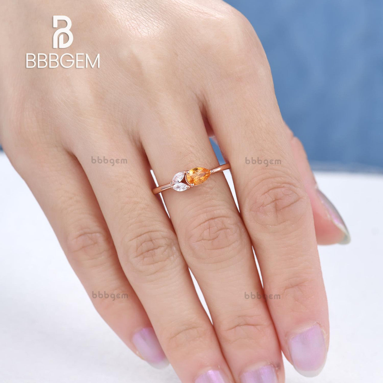 Exquisite East West Pear Shaped Spessartite Garnet Ring with Moissanite Accents - Basket Setting for Engagement, Anniversary & Special Occasions