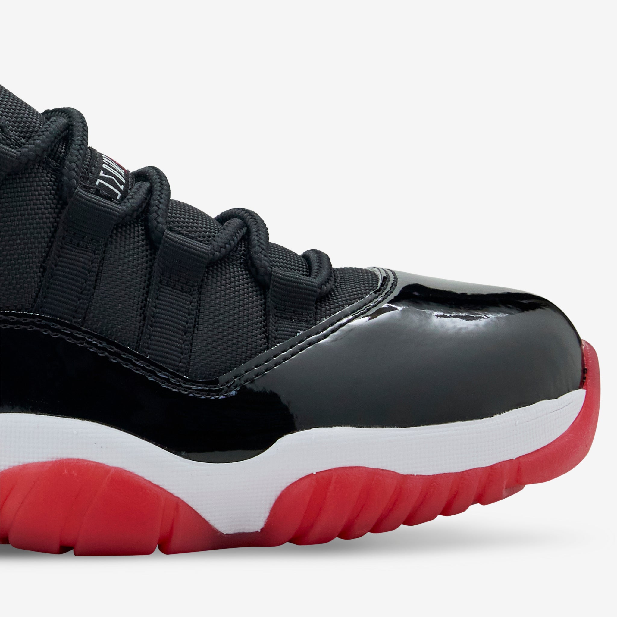 Air Jordan 11 Retro Low 'Bred' Men's Basketball Shoes - Black/Varsity Red/White | Classic Sneakers for Streetwear & Court Performance