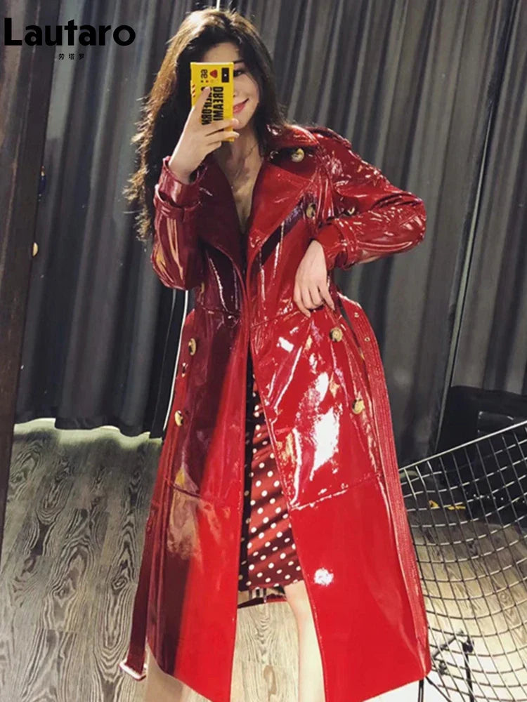 Women's Autumn Long Shiny Reflective Patent Faux Leather Trench Coat - Double Breasted Runway Style with Sashes | European Fashion Outerwear for Fall Season | Perfect for Evening Events, Parties and Fashion Shows