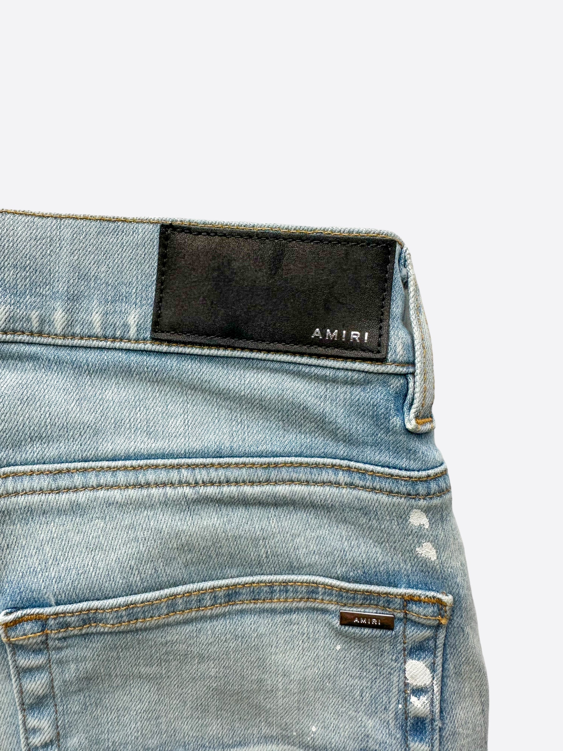 Amiri Blue MA Logo Stencil Jeans - Distressed Denim Pants for Men | Streetwear Fashion | Perfect for Casual Outfits & Night Out