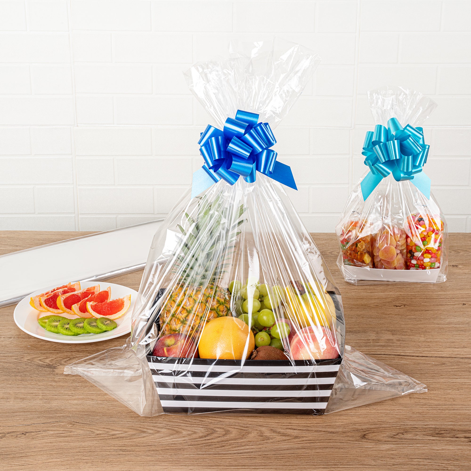 Clear Plastic Gift Basket Wrap Sheets - 25 x 30 Inches, 100 Count Box - Perfect for Party Favors, Wedding Decorations & Holiday Gift Wrapping