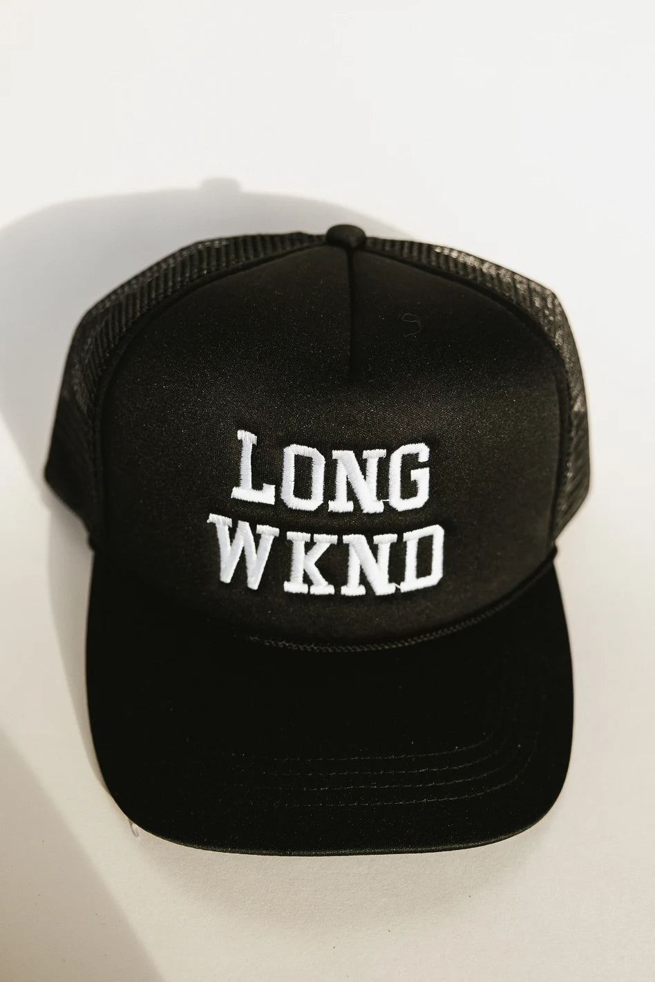 Long Weekend Trucker Hat in Black - Stylish & Comfortable Baseball Cap for Outdoor Activities, Travel, and Casual Wear