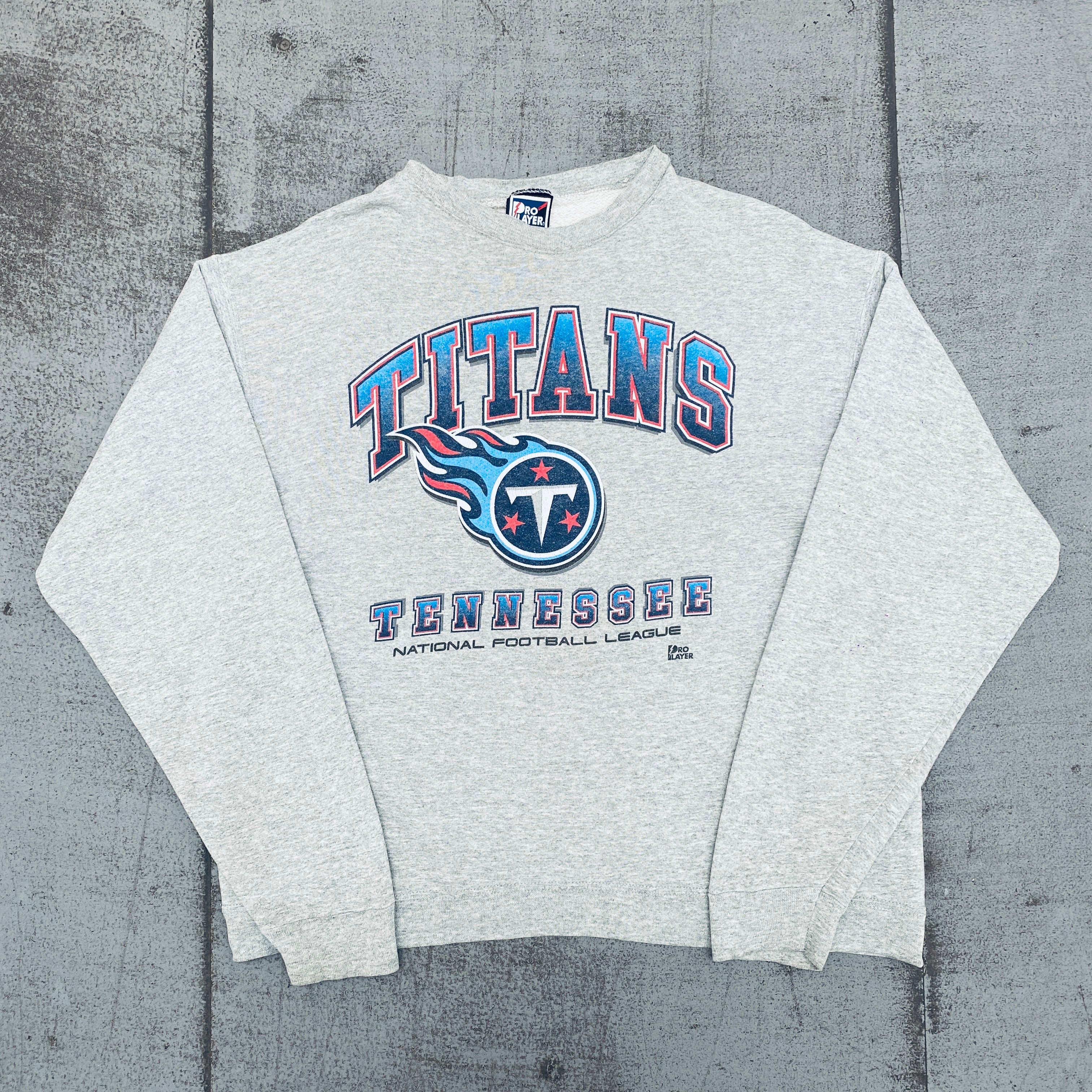 Tennessee Titans 1999 Pro Player Graphic Spellout Sweatshirt - Large Size NFL Vintage Fan Apparel for Game Day & Casual Wear