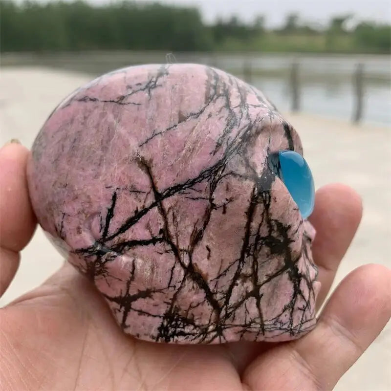 Natural Polished Rhodonite Crystal Alien Skull Carving - Healing Stone for Reiki, Feng Shui Decor, Unique Mineral Specimen Gift for Collectors & Spiritual Healing - Perfect for Meditation Spaces, Home Decor & Crystal Healing Practices