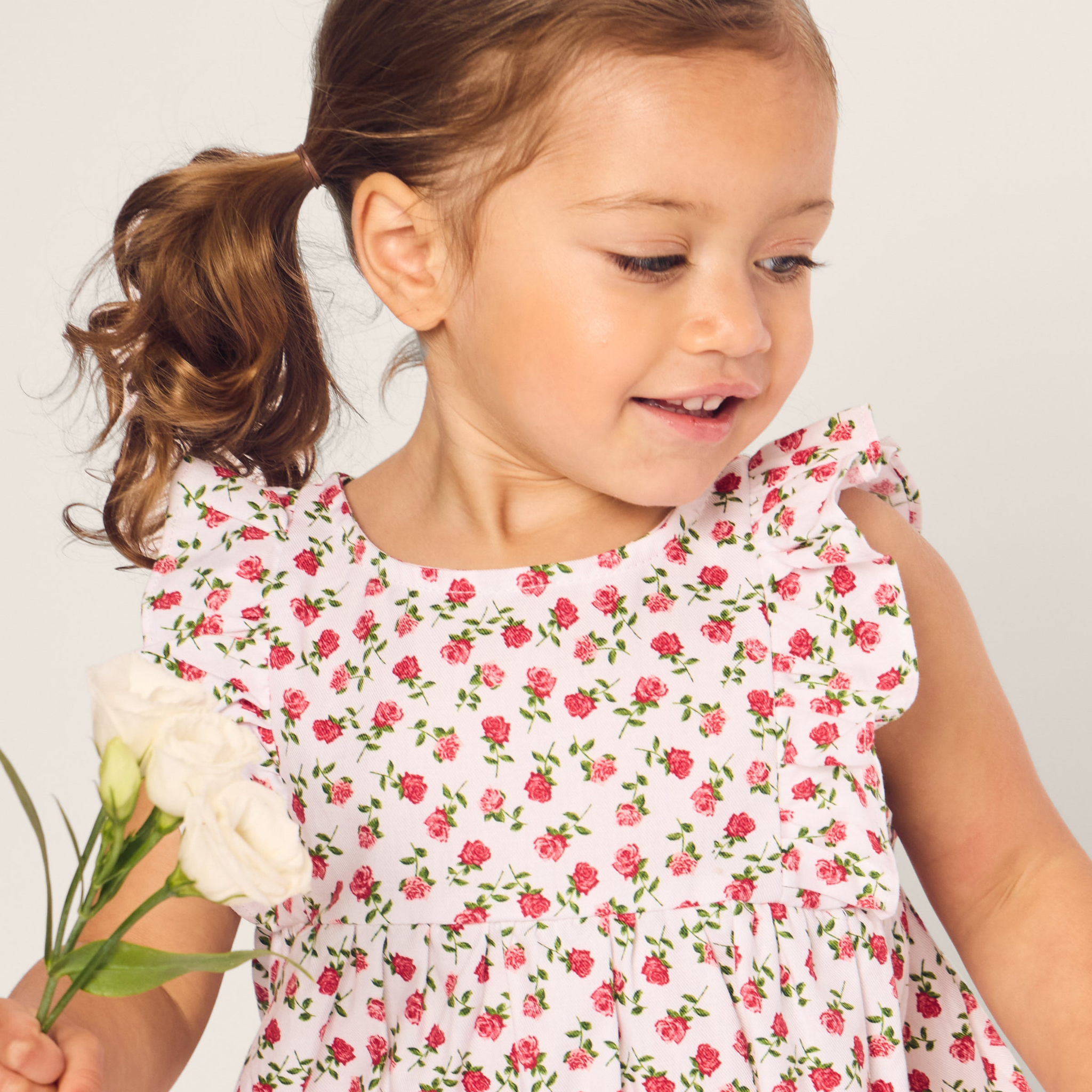 Adorable Baby's Twill Ruffled Romper in Petite Petals - Soft & Comfortable Outfit for Newborns & Infants - Perfect for Playdates, Photo Shoots & Special Occasions