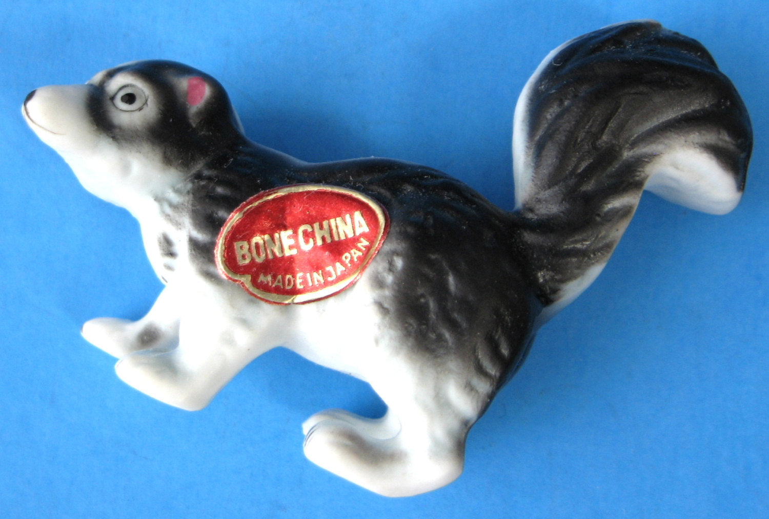 Skunk Family Figurines Set of 4 - Premium Bone China Collectibles with Original Box & Sticker (Made in Japan) - Perfect for Home Decor, Gift Giving, and Animal Lover Collections