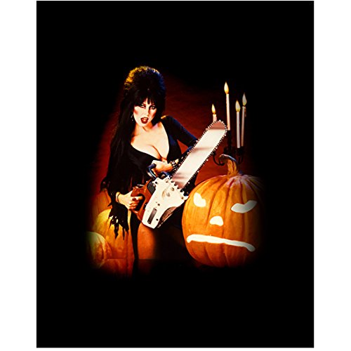 Elvira 8x10 Inch Photo - Mistress of the Dark with Chainsaw & Pumpkin Candles Background (Pose 2) - Collectible Horror Memorabilia for Halloween Decor & Goth Home Theater Display