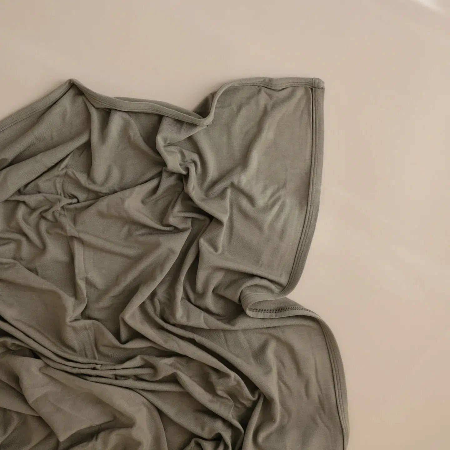 Mushie Stretchy Swaddle Blanket - Soft & Breathable Baby Wrap for Newborns - Dried Thyme Color - Perfect for Swaddling, Nursing & Comforting Infants