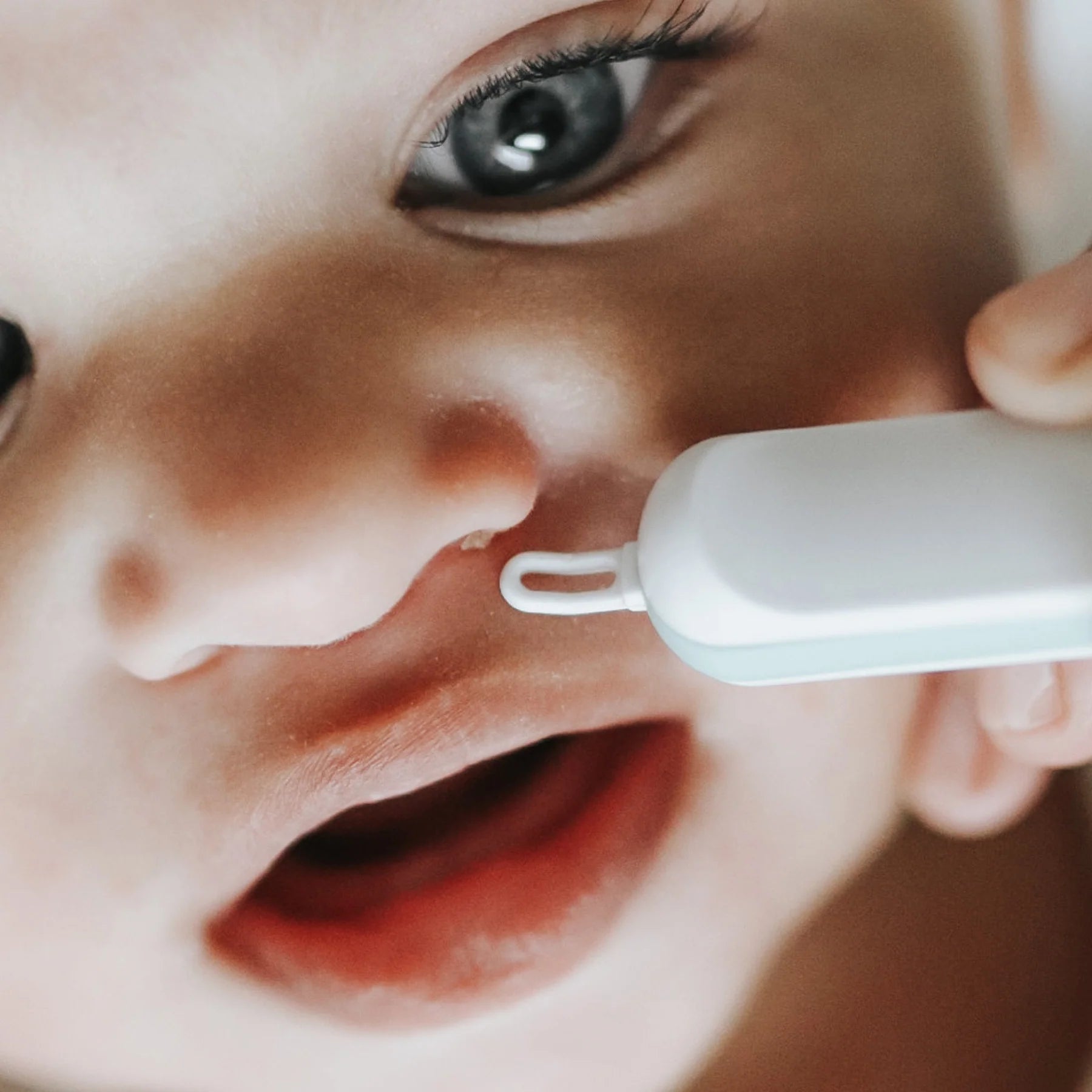 Frida Baby 3-in-1 Nose & Ear Cleaner Tool - Safe Baby Nose Sucker, Ear Wax Remover, and Nail Clipper Set for Newborns & Infants - Perfect for Gentle Hygiene Care at Home or Travel