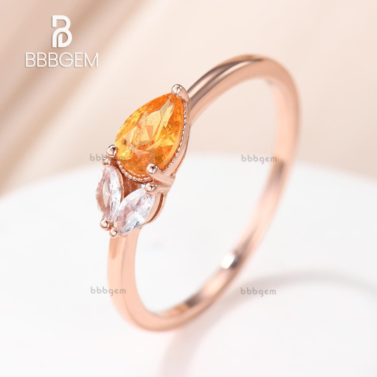 Exquisite East West Pear Shaped Spessartite Garnet Ring with Moissanite Accents - Basket Setting for Engagement, Anniversary & Special Occasions