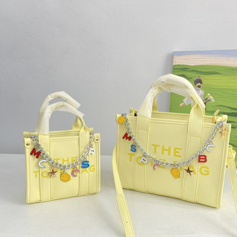 Stylish Letter Chain Tote Bag for Women - Trendy Canvas Shoulder Bag with Metal Chain Strap - Perfect for Shopping, Beach, Work & Daily Use