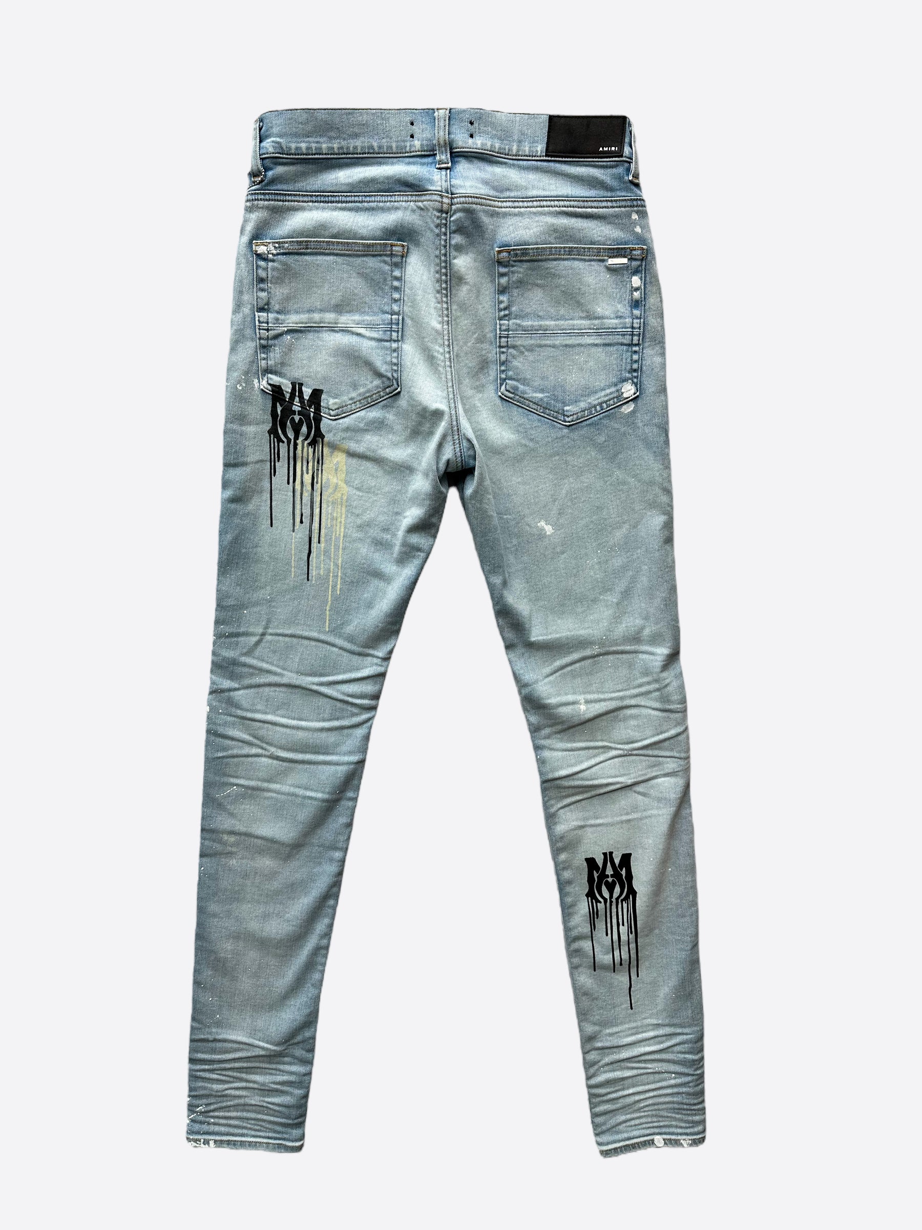 Amiri Blue MA Logo Stencil Jeans - Distressed Denim Pants for Men | Streetwear Fashion | Perfect for Casual Outfits & Night Out