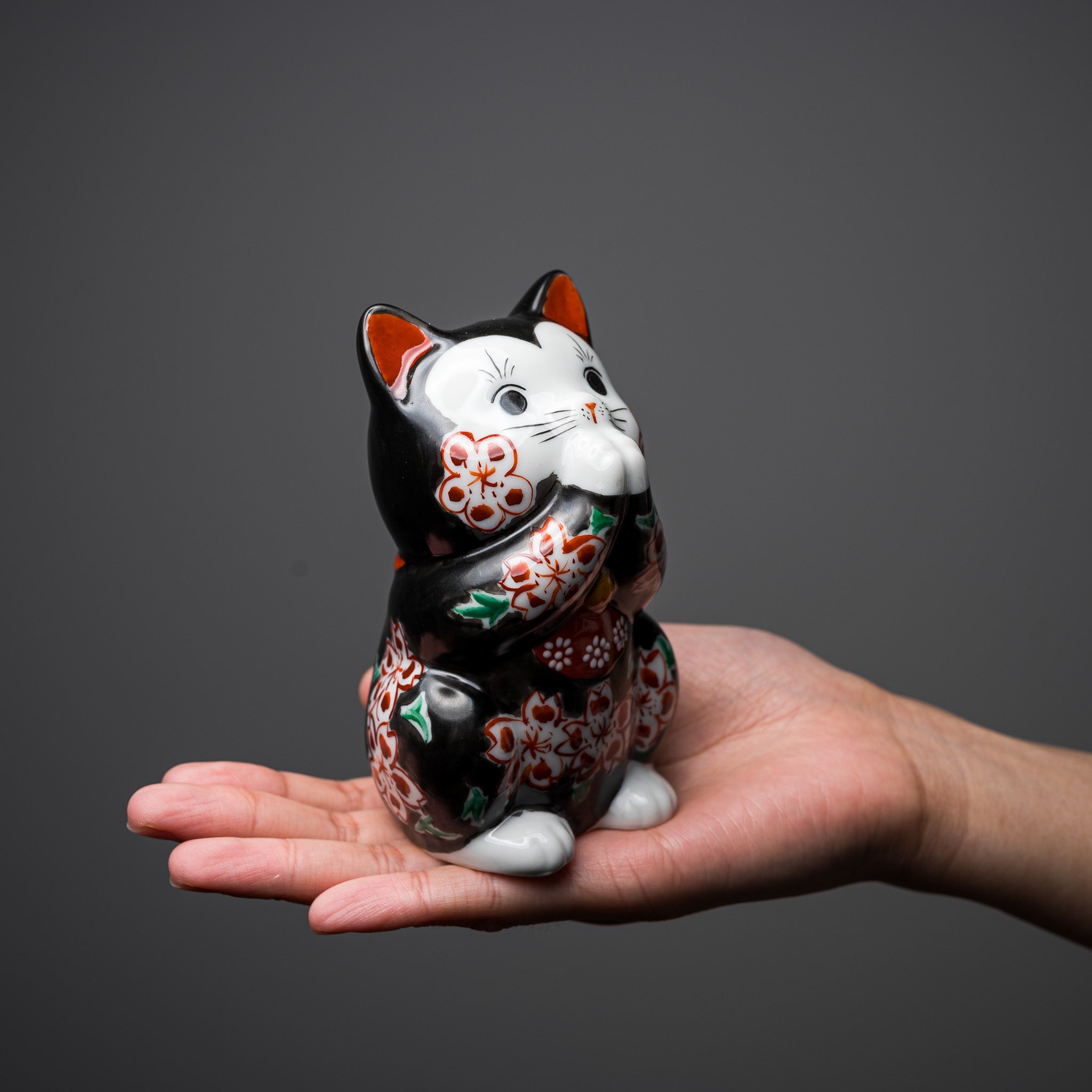 Handmade Kutani Ware Black Flower Begging Cat Ornament 'Sakura' - Japanese Traditional Ceramic Lucky Charm for Home Decor, Office Desk & Gift Giving