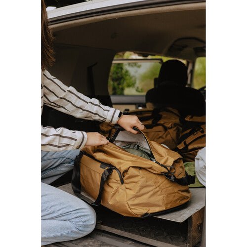 Peak Design Travel Duffel 35L Carry-On Duffel Bag - Waterproof & Durable Coyote Brown Backpack for Adventure Travel, Camping & Outdoor Activities