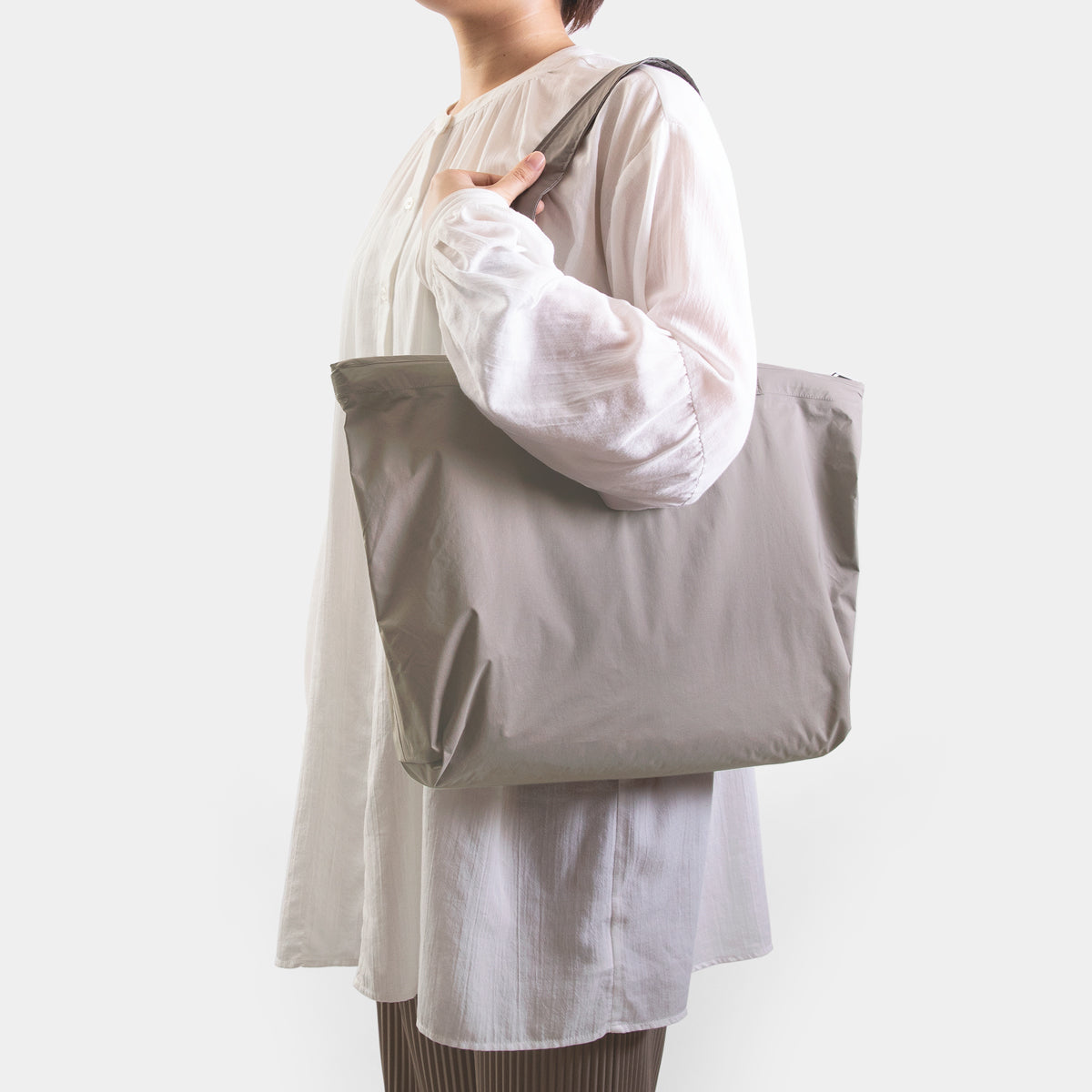 TRAVELER'S COMPANY Traveler's Factory x TO&FRO Waterproof Rain Bag in Warm Gray - Perfect for Outdoor Adventures, Commuting & Travel