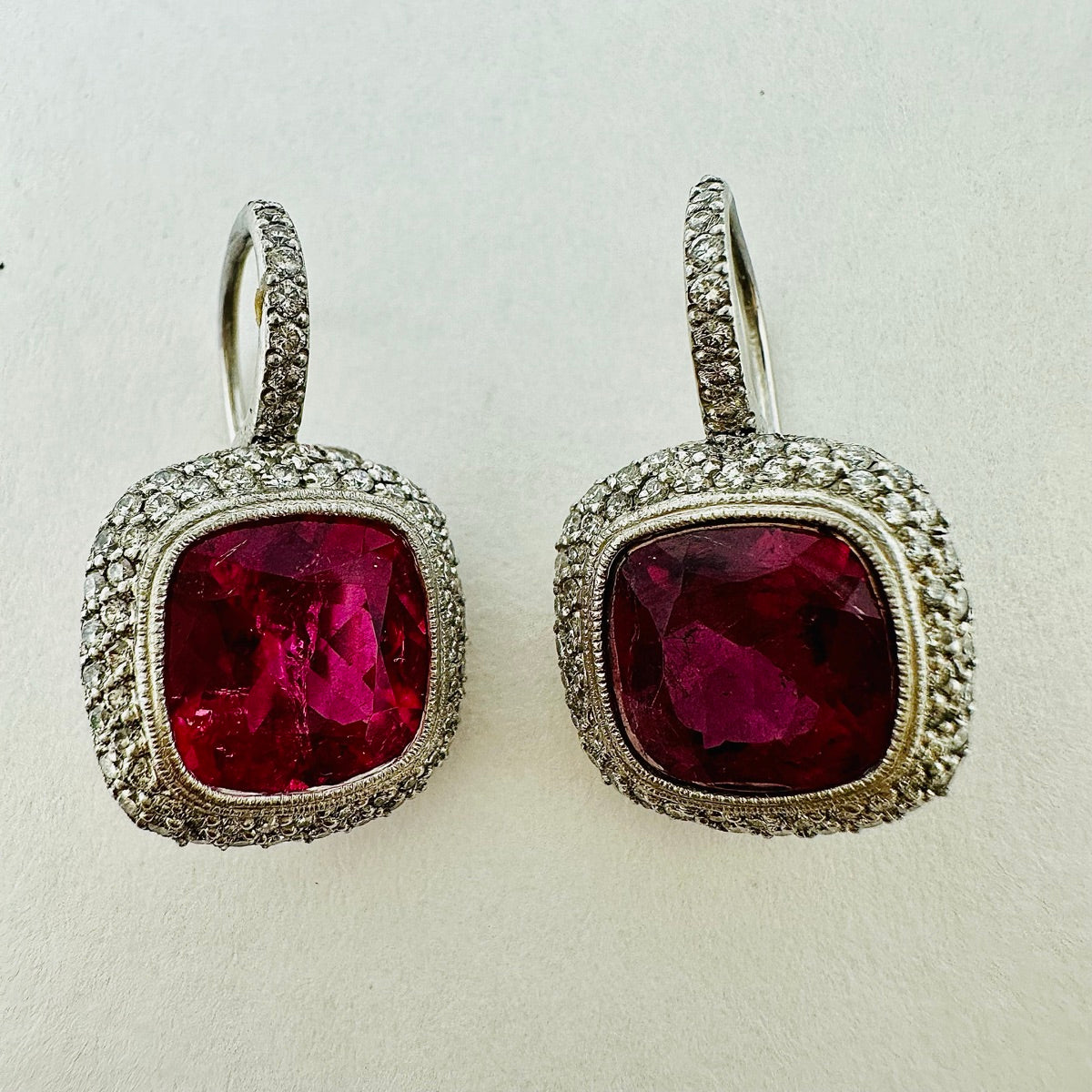 Platinum Double Halo Dangle Earrings with Bezel Set Rubellites - Elegant Jewelry for Weddings, Parties & Special Occasions