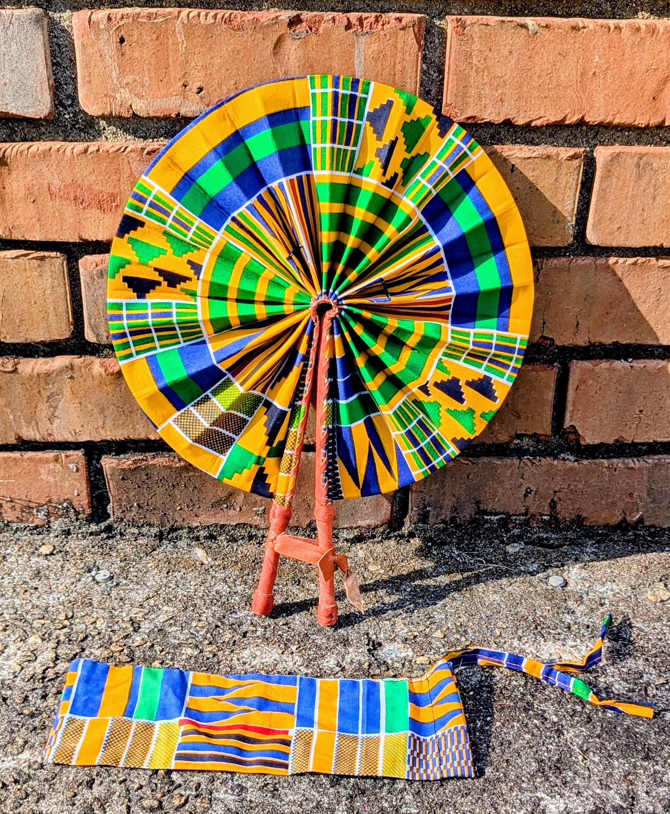 Dupsie's Afiokuma Foldable African Print Kente Hand Fan with Leather Handle DPPF4075 - Stylish Cooling Accessory for Weddings, Parties & Cultural Events