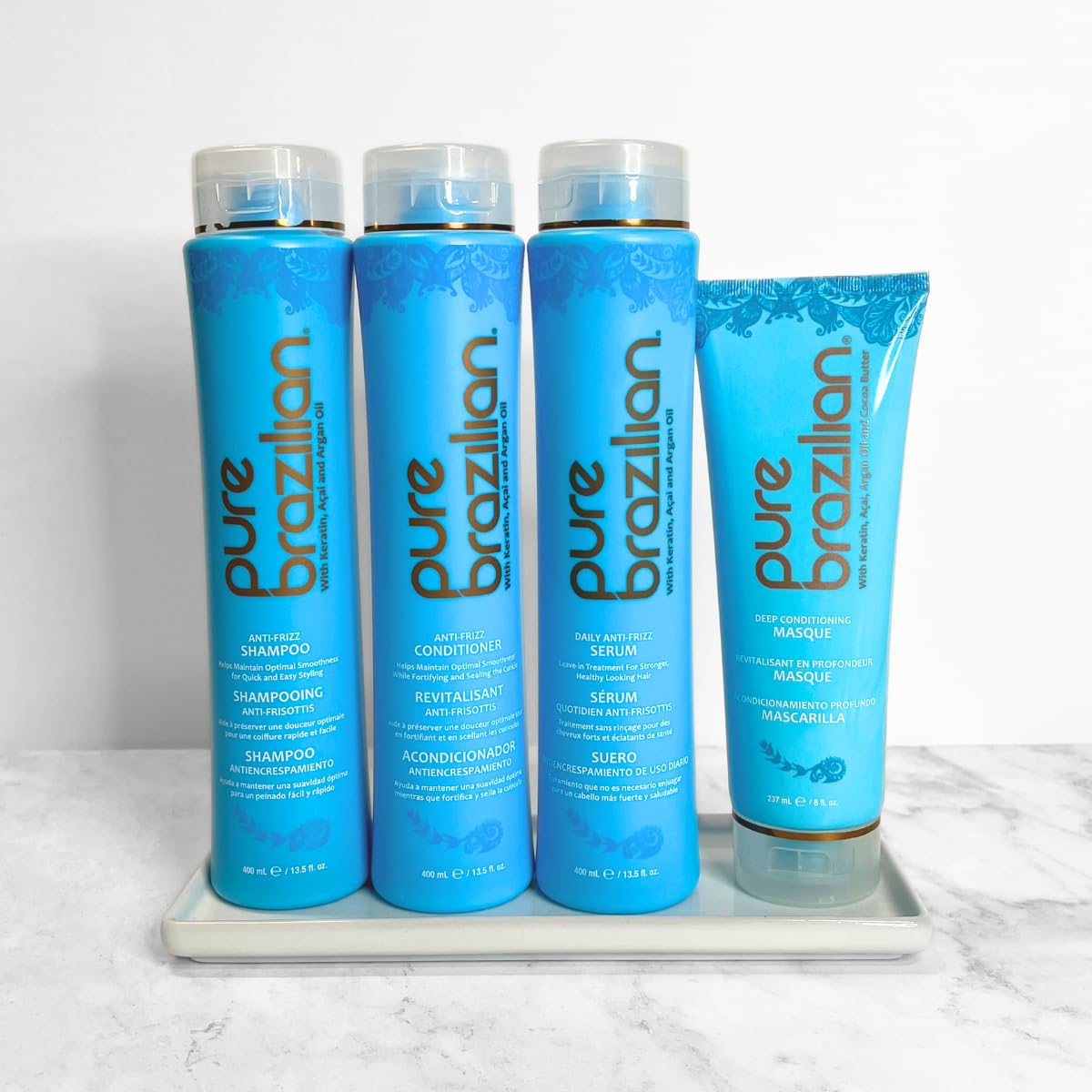 Pure Brazilian 4-Piece Hair Care Kit - Anti-Frizz Shampoo, Nourishing Conditioner, Hydrating Serum & Restorative Hair Mask for Smooth, Healthy Hair - Perfect for Dry, Damaged & Frizzy Hair Treatment at Home or Salon