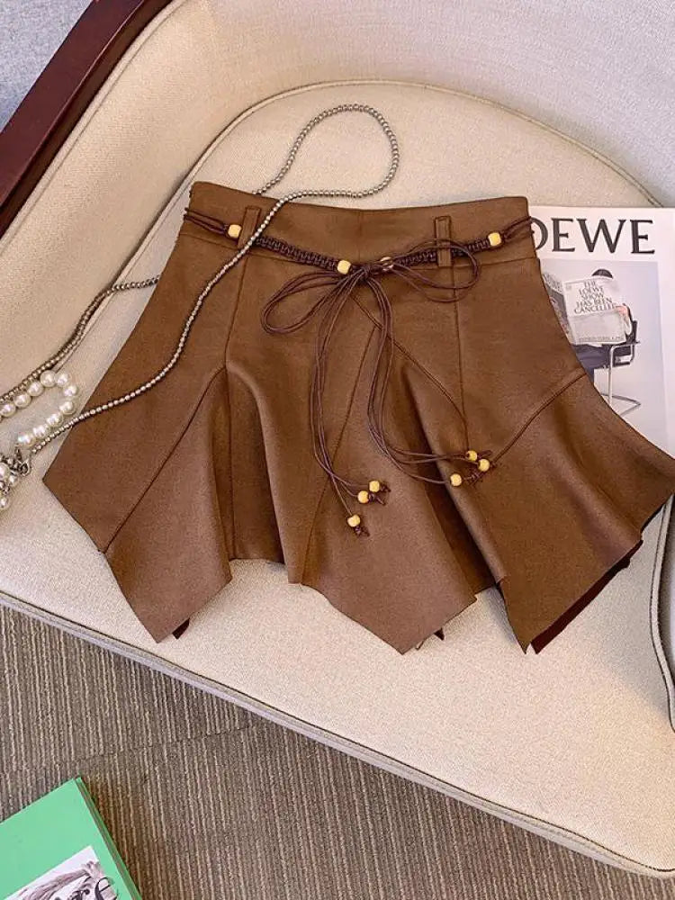 2024 Retro High Waist Black & Brown PU Leather Pleated Mini Skirt for Women - Sexy Bandage Club Skirt with Irregular Hem | Perfect for Night Out, Party, and Fashion Streetwear