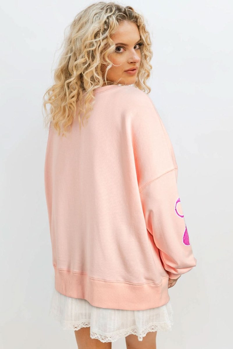 Stylish Apricot Pink Sequined Bowknot Drop Shoulder Oversized Sweatshirt for Women | Trendy Loose Fit Pullover | Perfect for Casual Outings, Parties & Date Nights