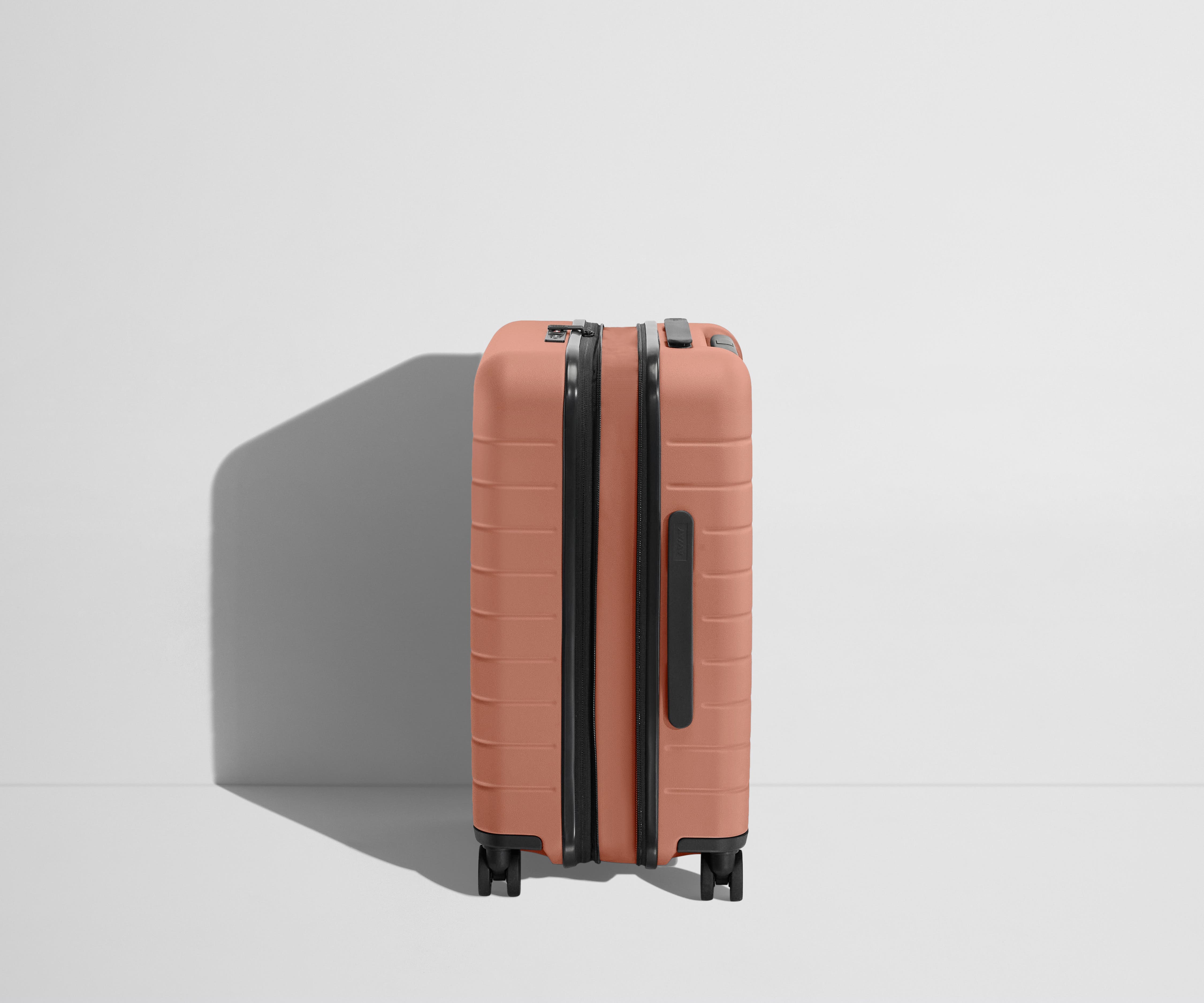 The Carry On Flex in Clay Pink - Lightweight Expandable Luggage for Travel, Business Trips & Weekend Getaways