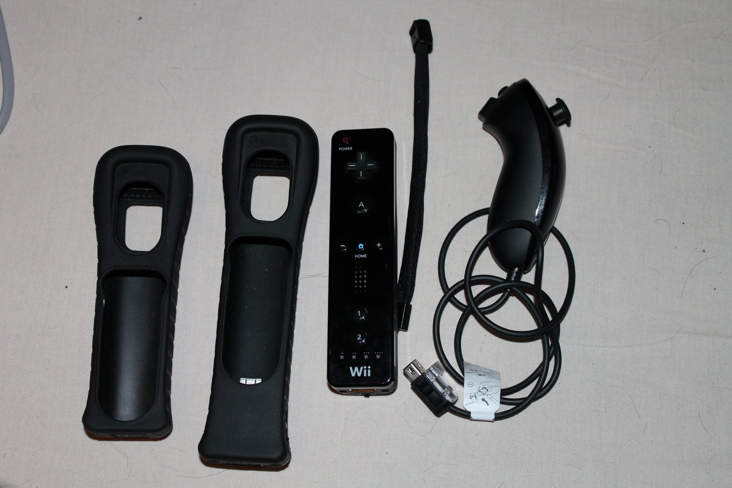 Original Wii Console Black Bundle with Wii Sports & Wii Sports Resort - Includes Black Wii Remote Plus - Perfect for Family Game Nights & Retro Gaming Fun