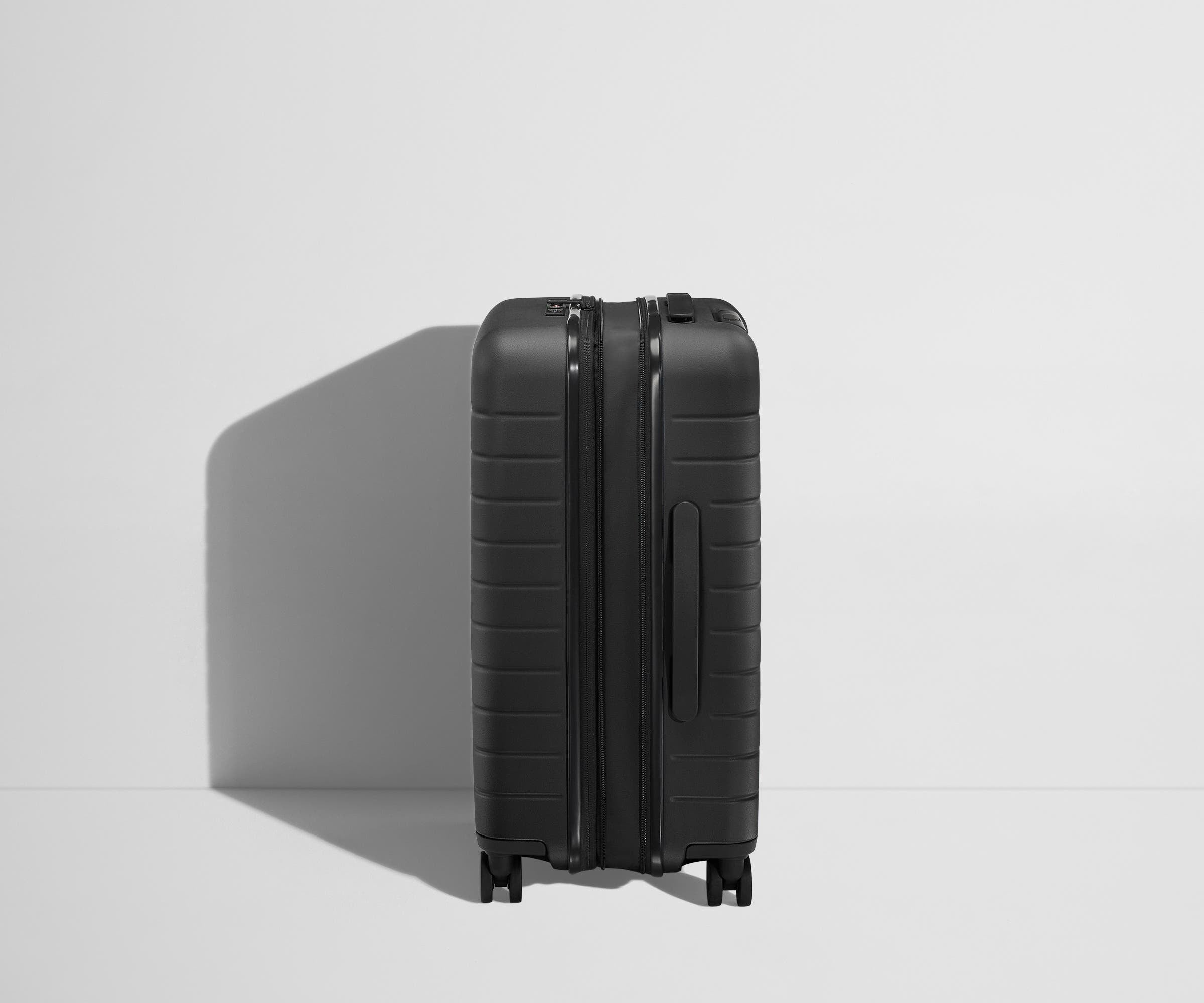 The Bigger Carry On Flex Suitcase - Jet Black Expandable Luggage for Travel & Business Trips | Lightweight & Durable Spinner Bag