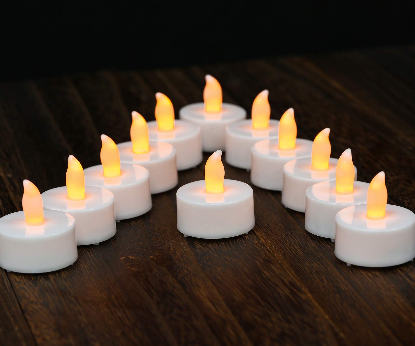 12 Pack Long-Lasting 150-Hour Battery Operated LED Tea Lights - Realistic Flickering Flameless Candles in Warm Yellow for Wedding Centerpieces, Halloween Decor, Christmas Displays & Valentine's Day Romance - Indoor/Outdoor Safe Decorative Lighting