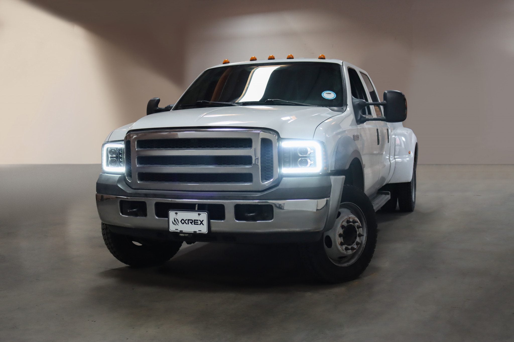 05-07 Ford Super Duty/Excursion LUXX Series LED Projector Headlights Alpha Black - High Performance Lighting Upgrade for Night Driving & Off-Road Adventures