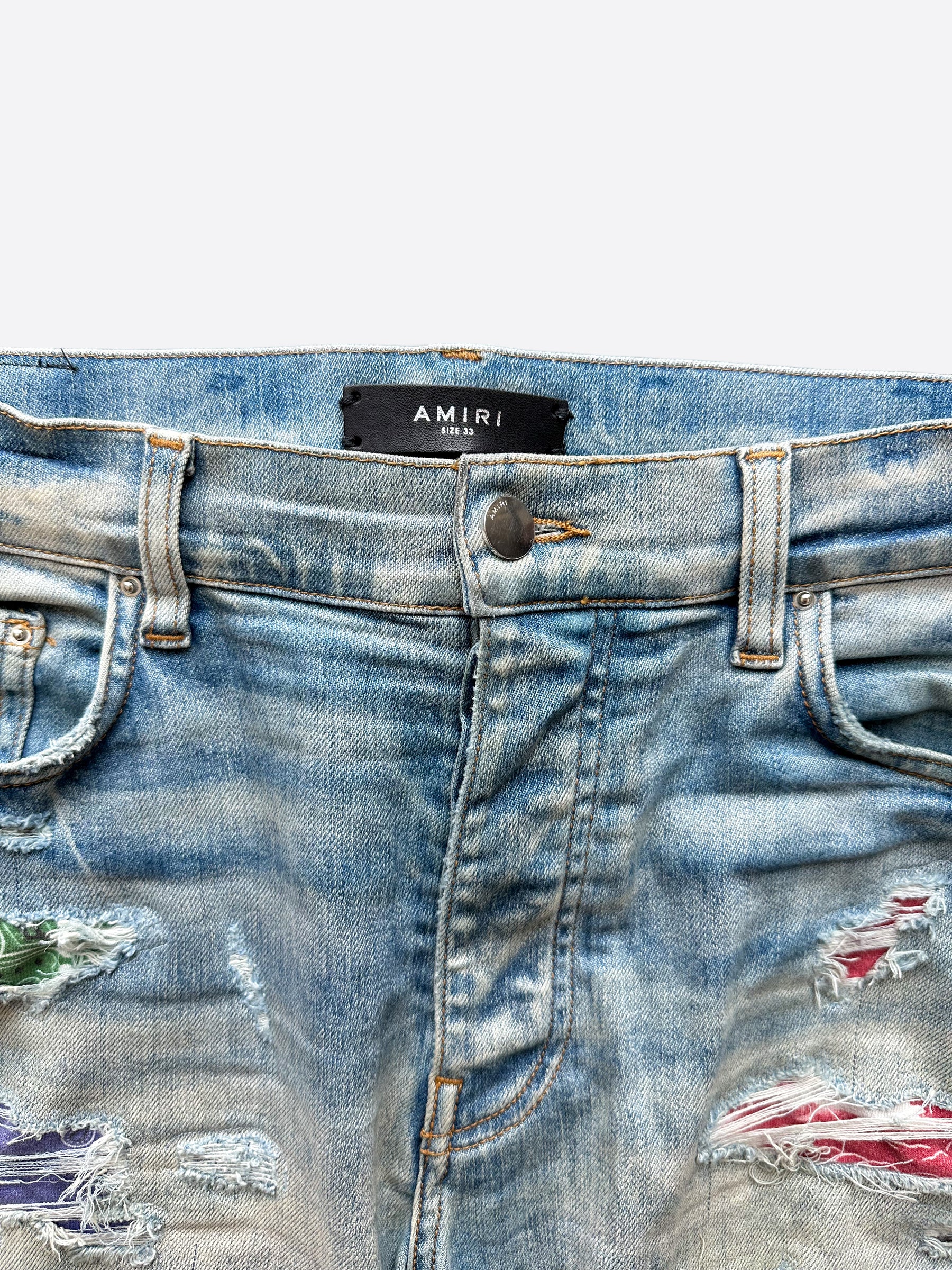 Amiri Blue Distressed Jeans with Multicolor Patches - Stylish Ripped Denim Pants for Men | Perfect for Casual Outfits, Streetwear & Night Out Looks