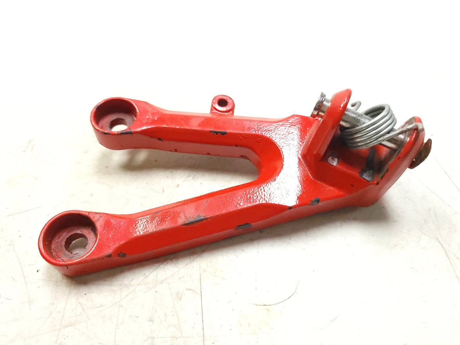 04-05 Honda CBR1000RR Foot Peg Bracket Left Side OEM Replacement Part - Perfect for Motorcycle Repair & Racing Upgrades
