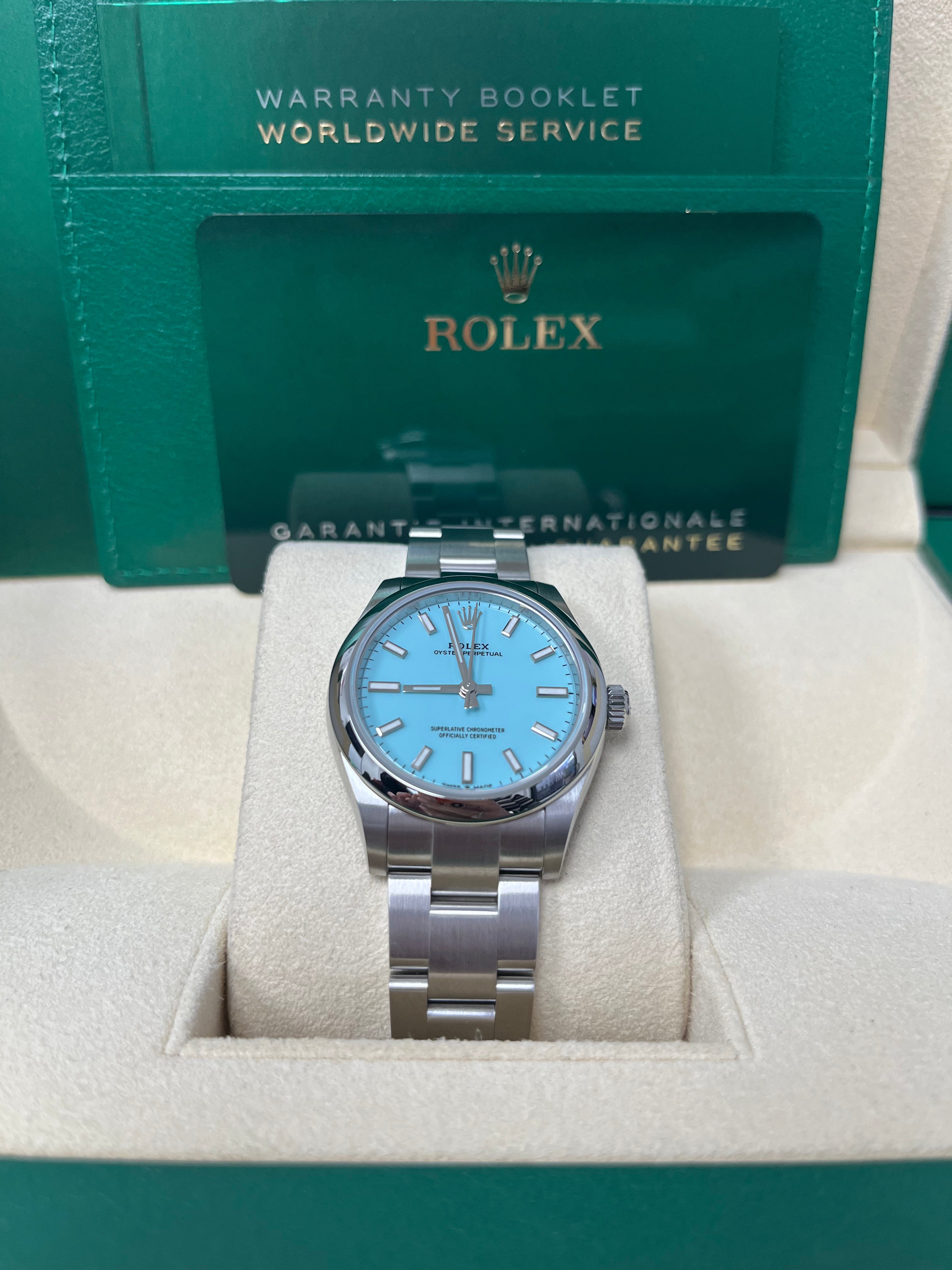 Rolex Oyster Perpetual 31mm Watch - Domed Bezel, Turquoise Blue Index Dial, Oyster Bracelet (Model 277200) | Luxury Women's Watch for Business, Parties & Special Occasions